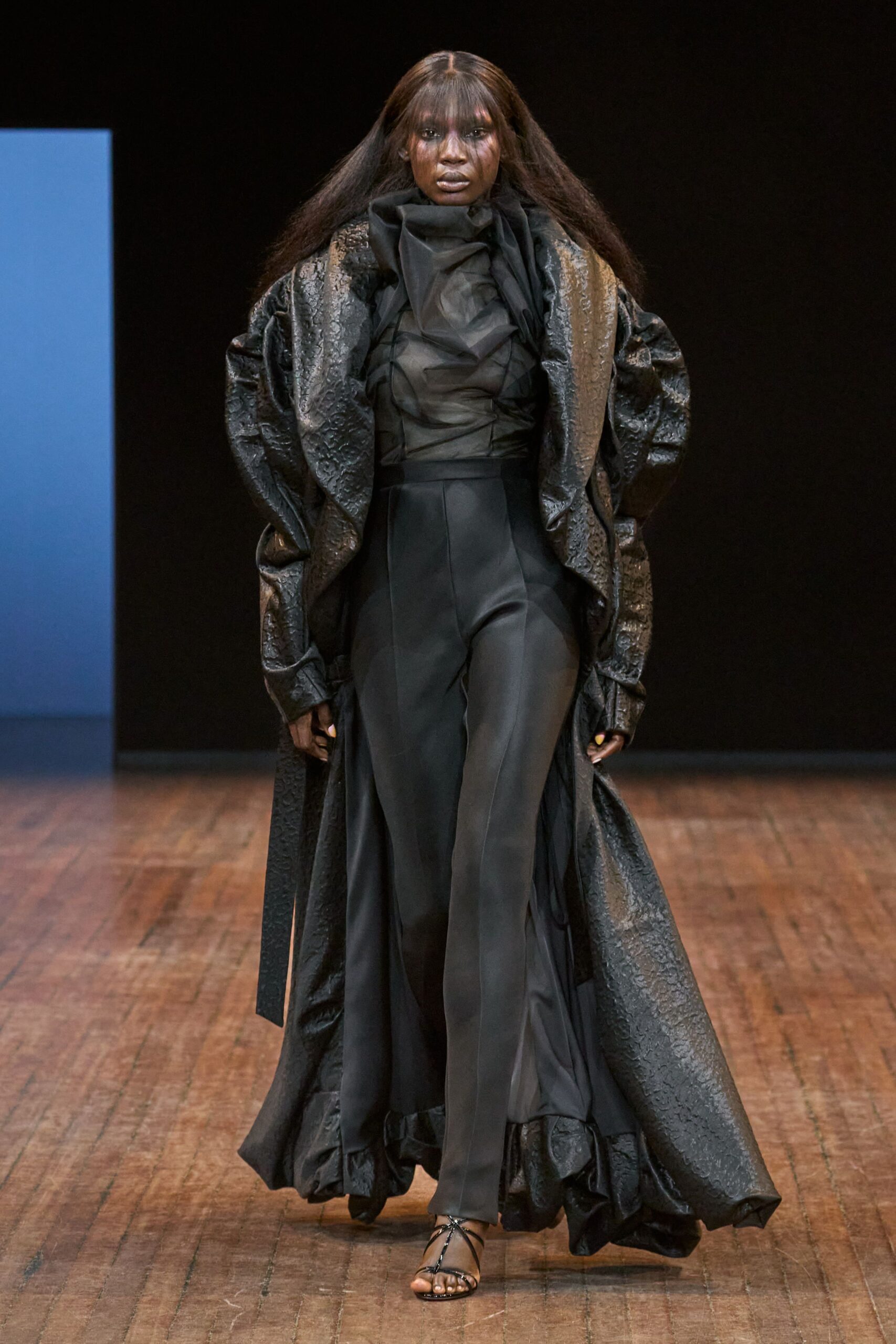 black leather long-sleeve oversized ruffled shiny coat