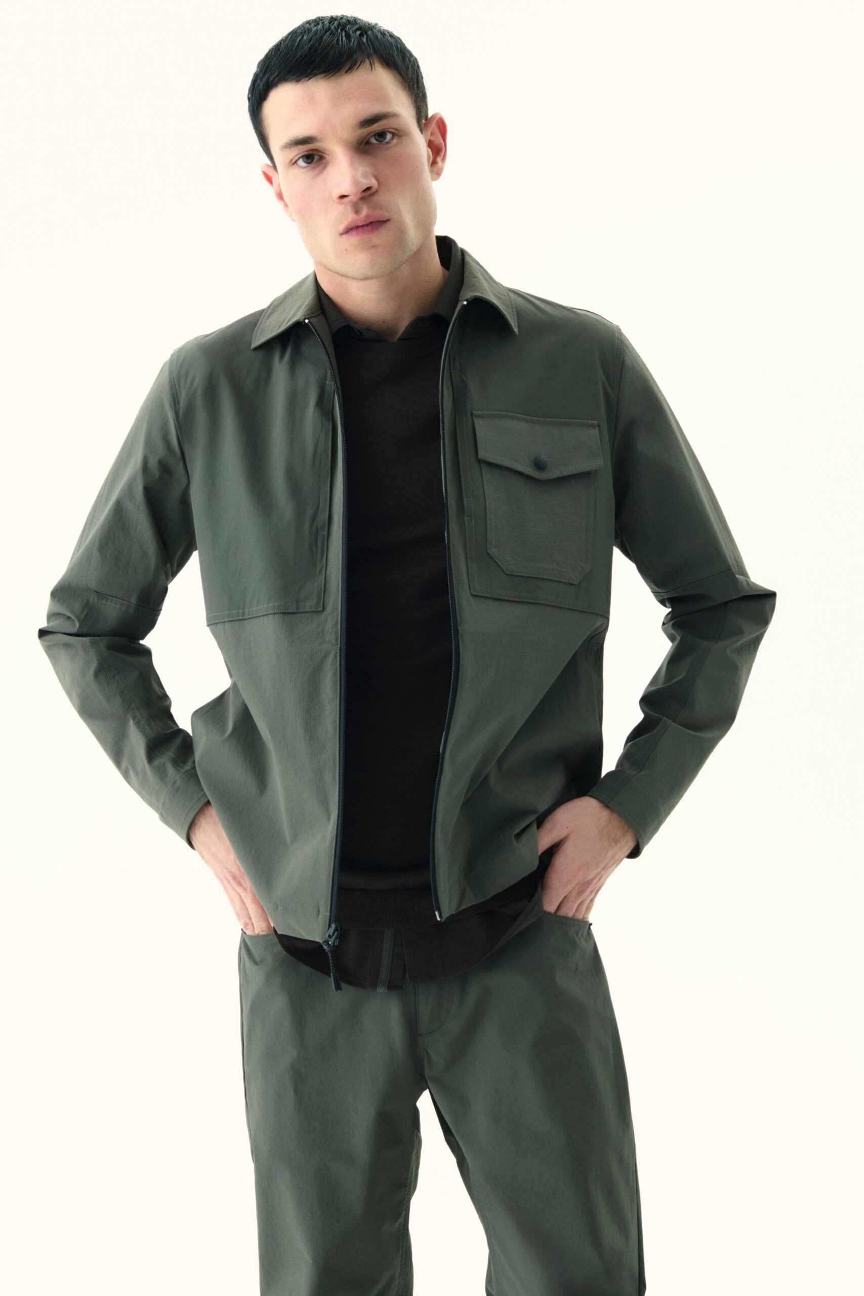 green fitted jacket and pants