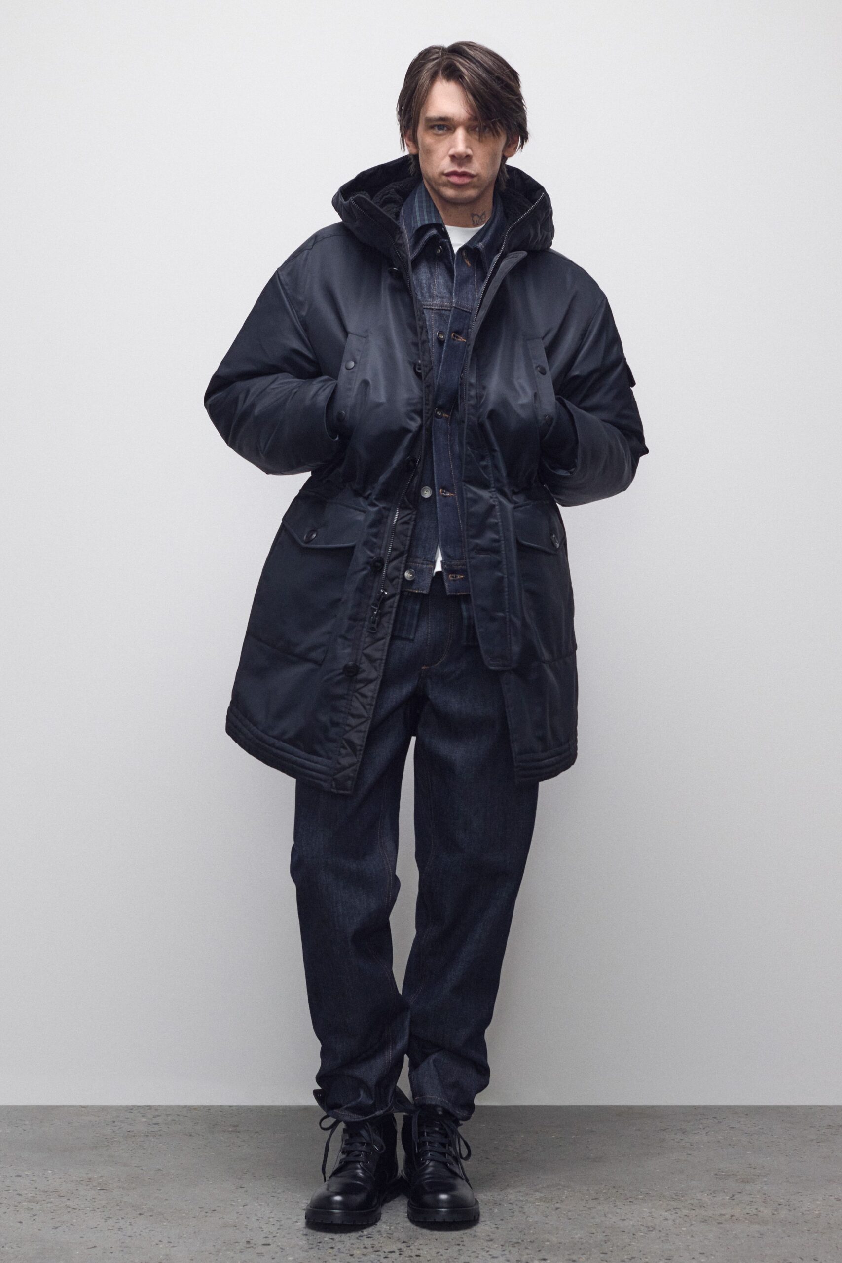 black parka with blue shirt