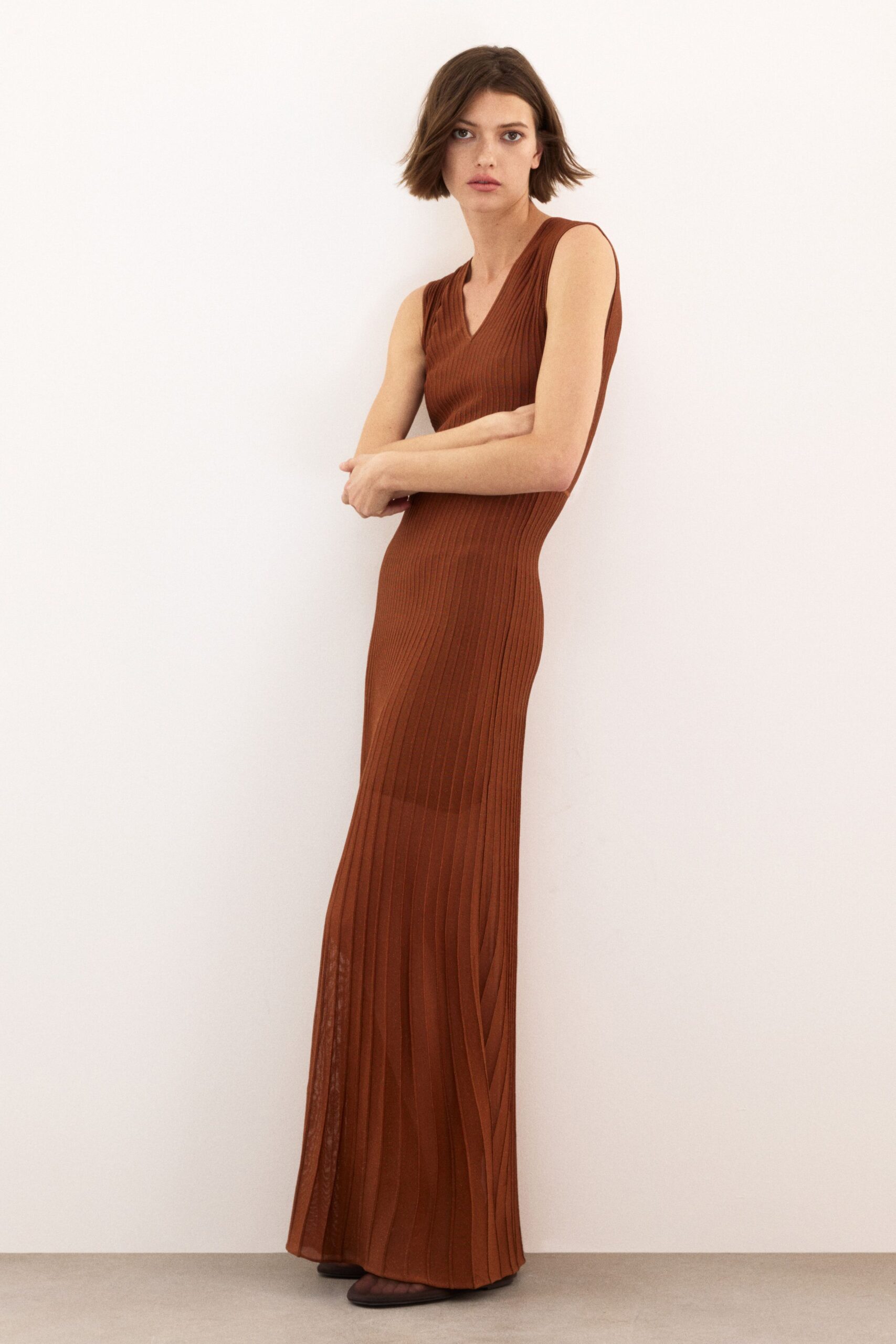 brown cotton sleeveless v-neck fitted pleated flowing dress
