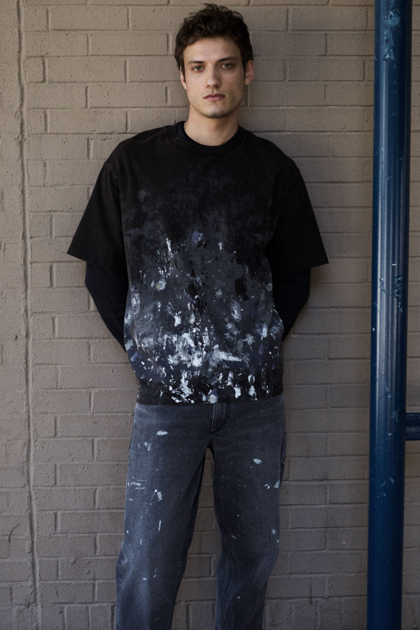 black and white printed t-shirt with gray jeans
