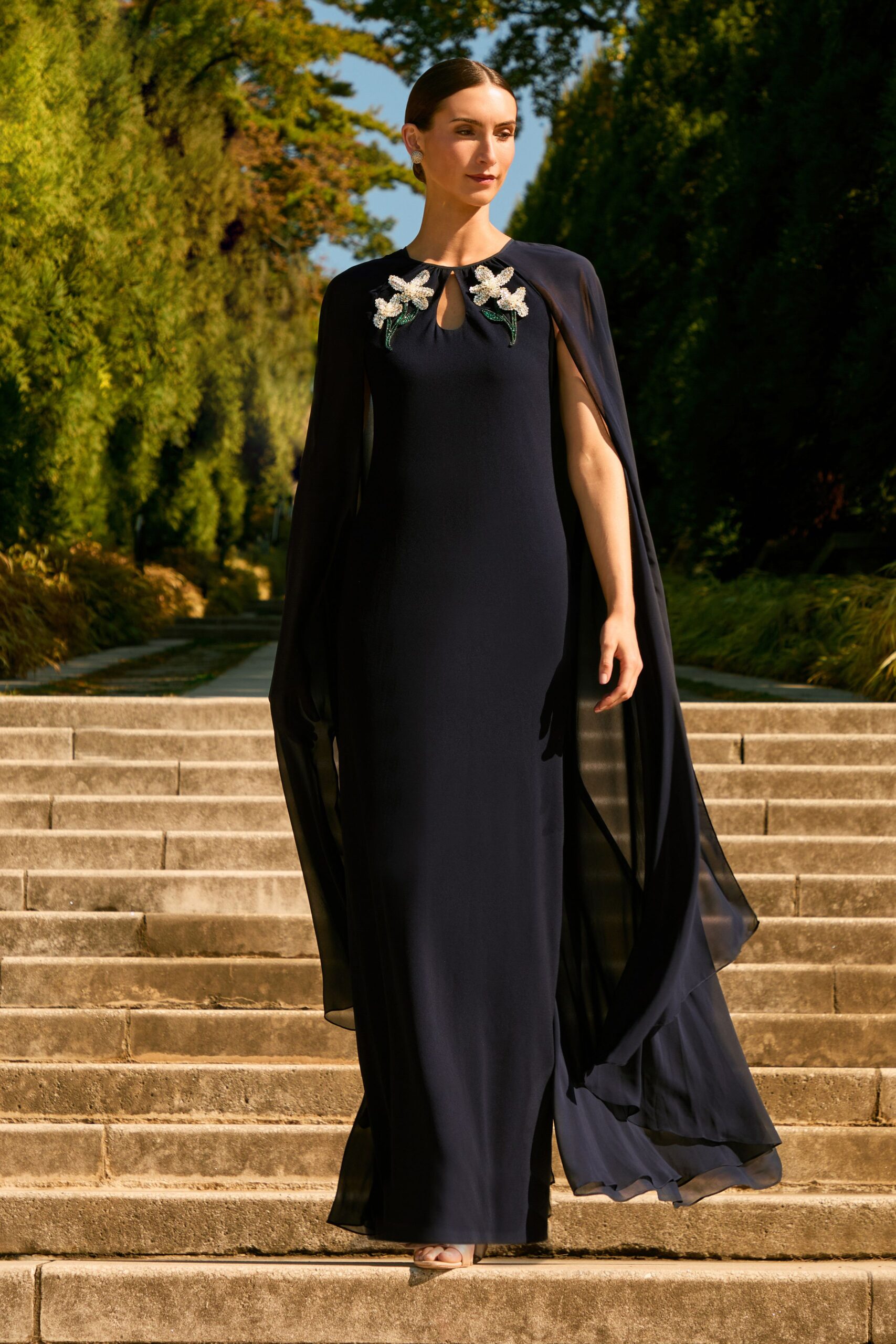 navy silk fitted gown with cape