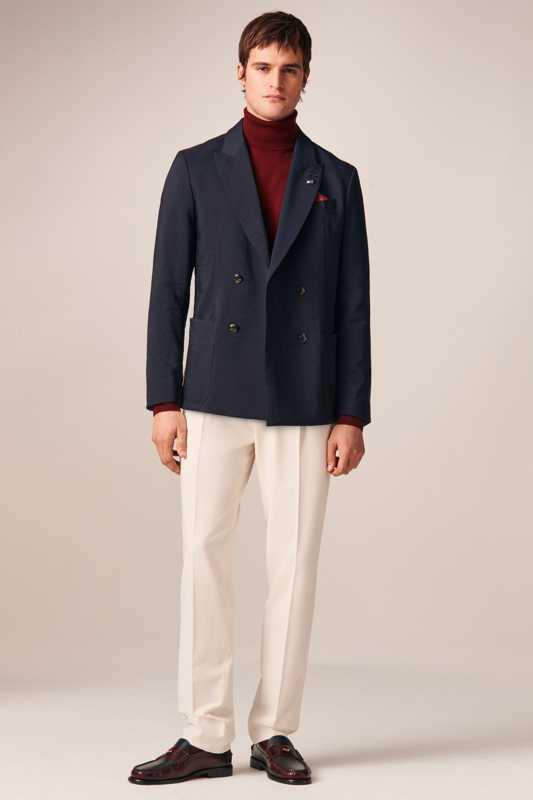 navy blazer with red turtleneck