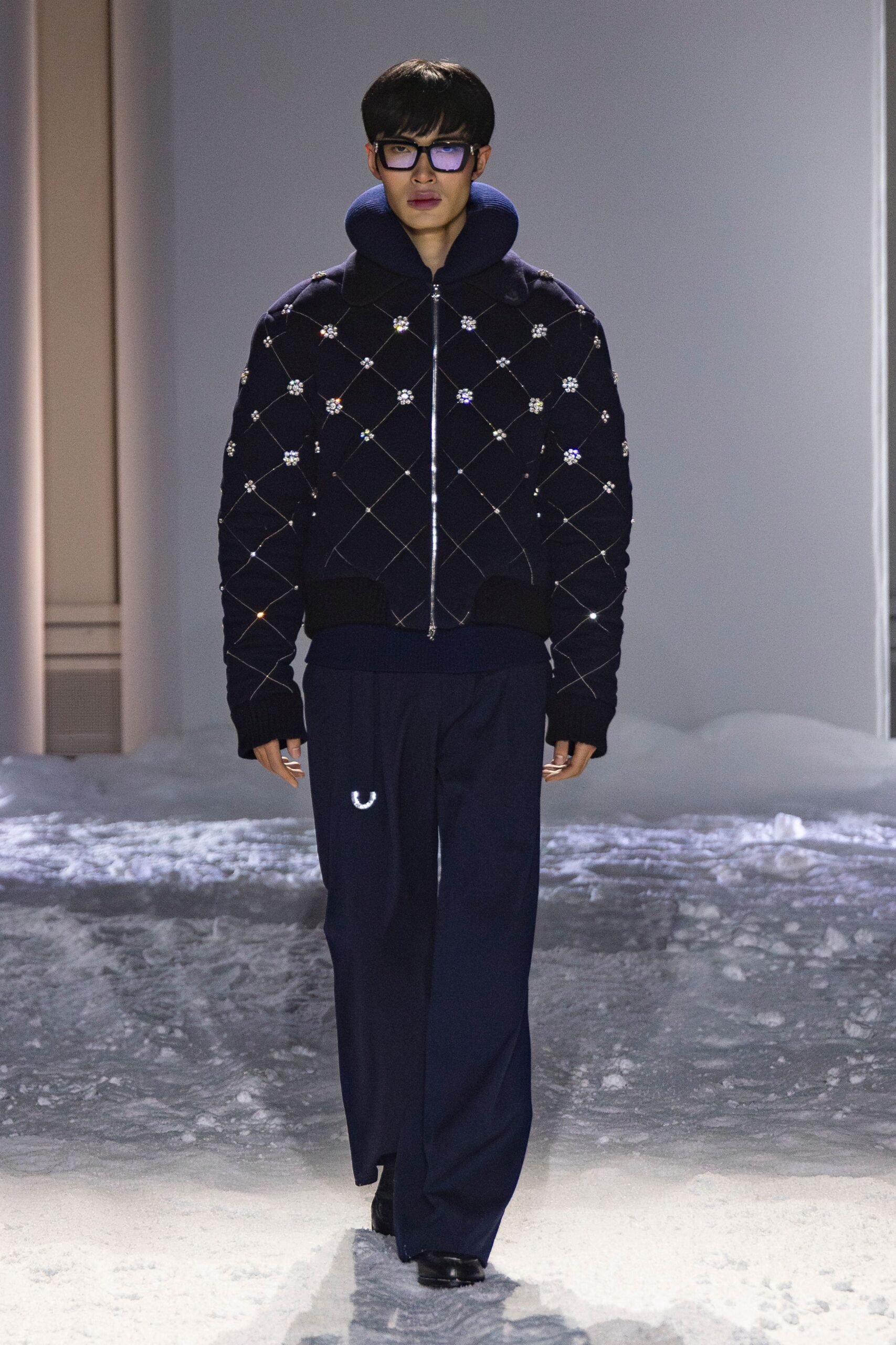 black embroidered jacket with navy pants