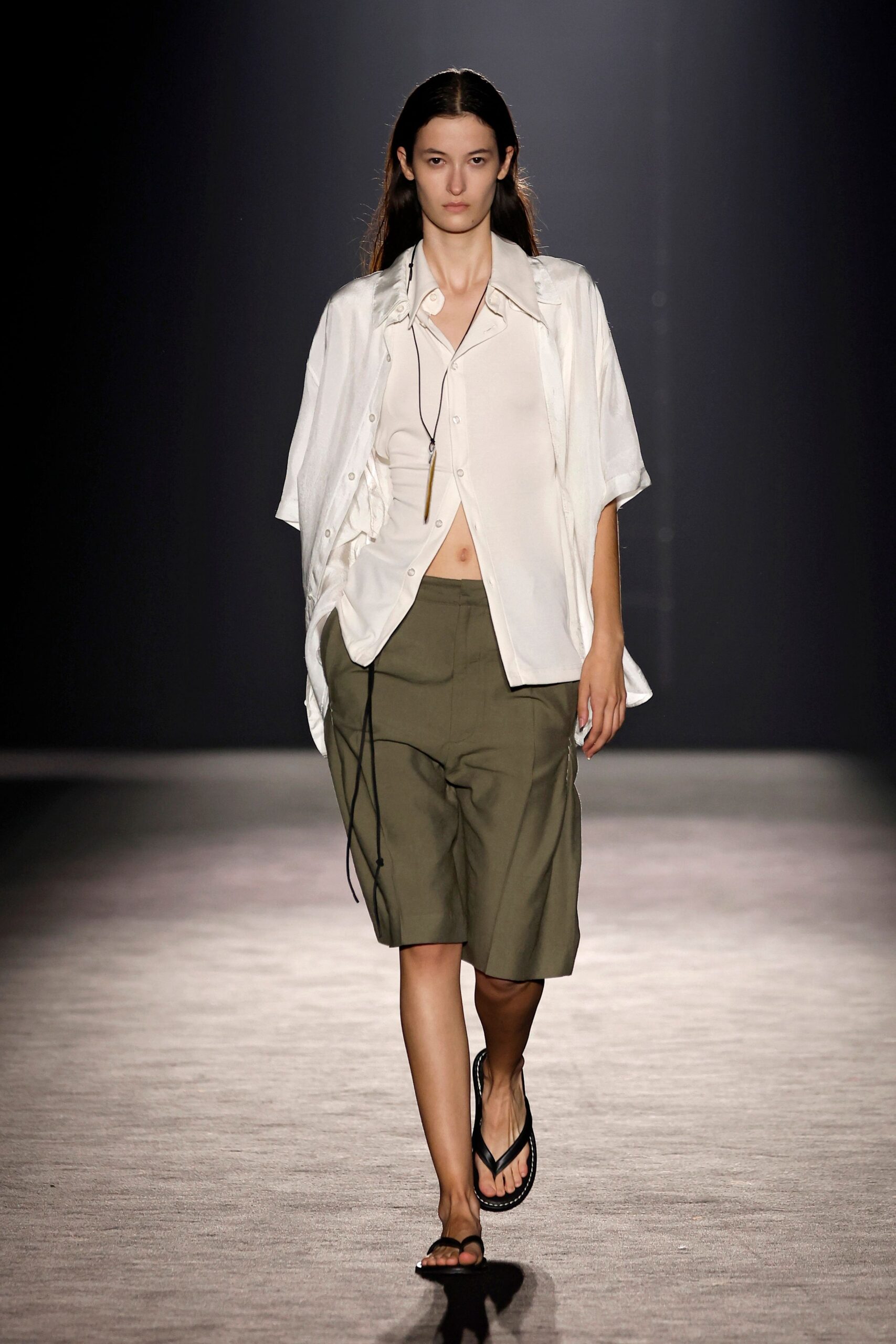 white relaxed shirt with green shorts