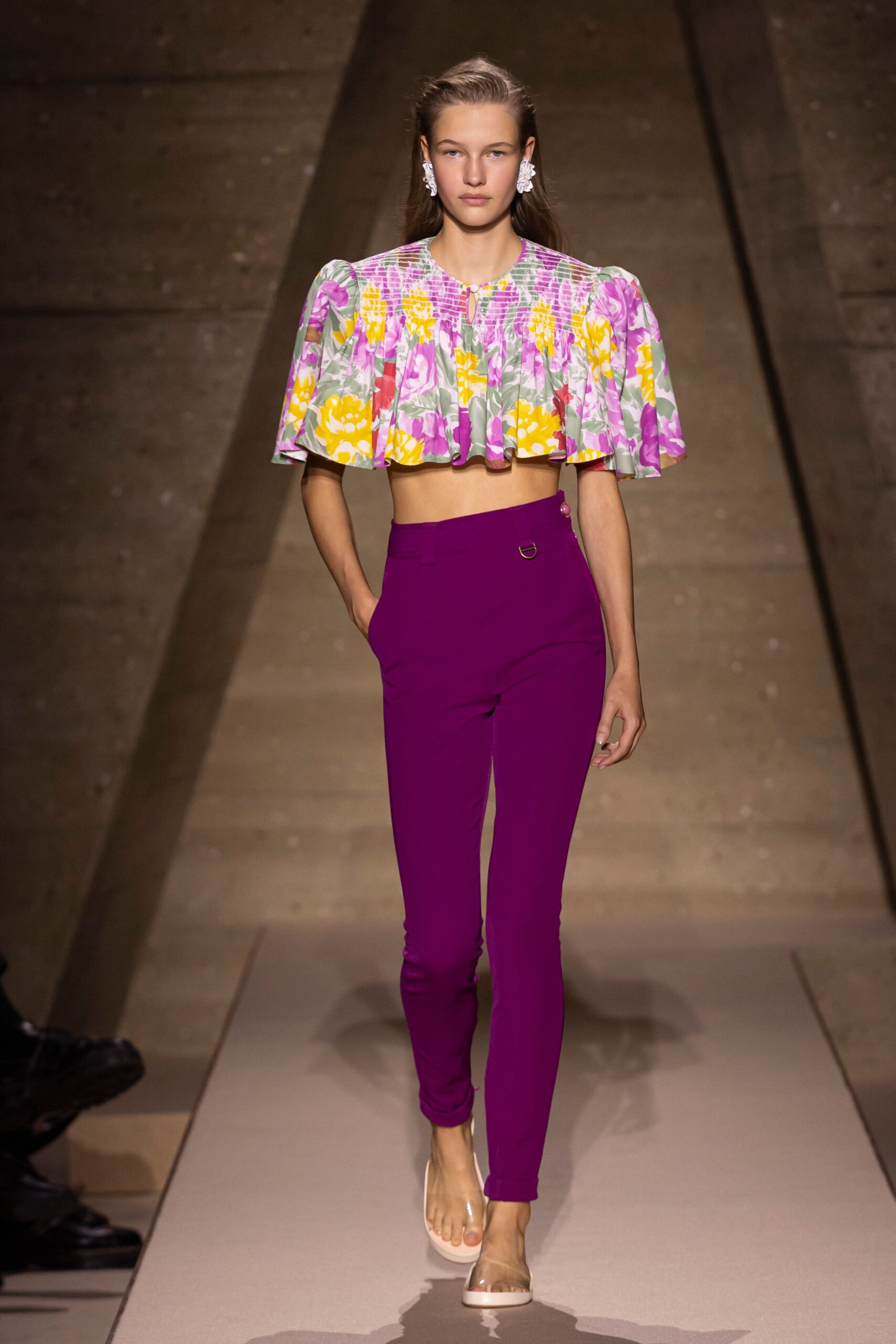 multi-colored ruffled top with purple pants