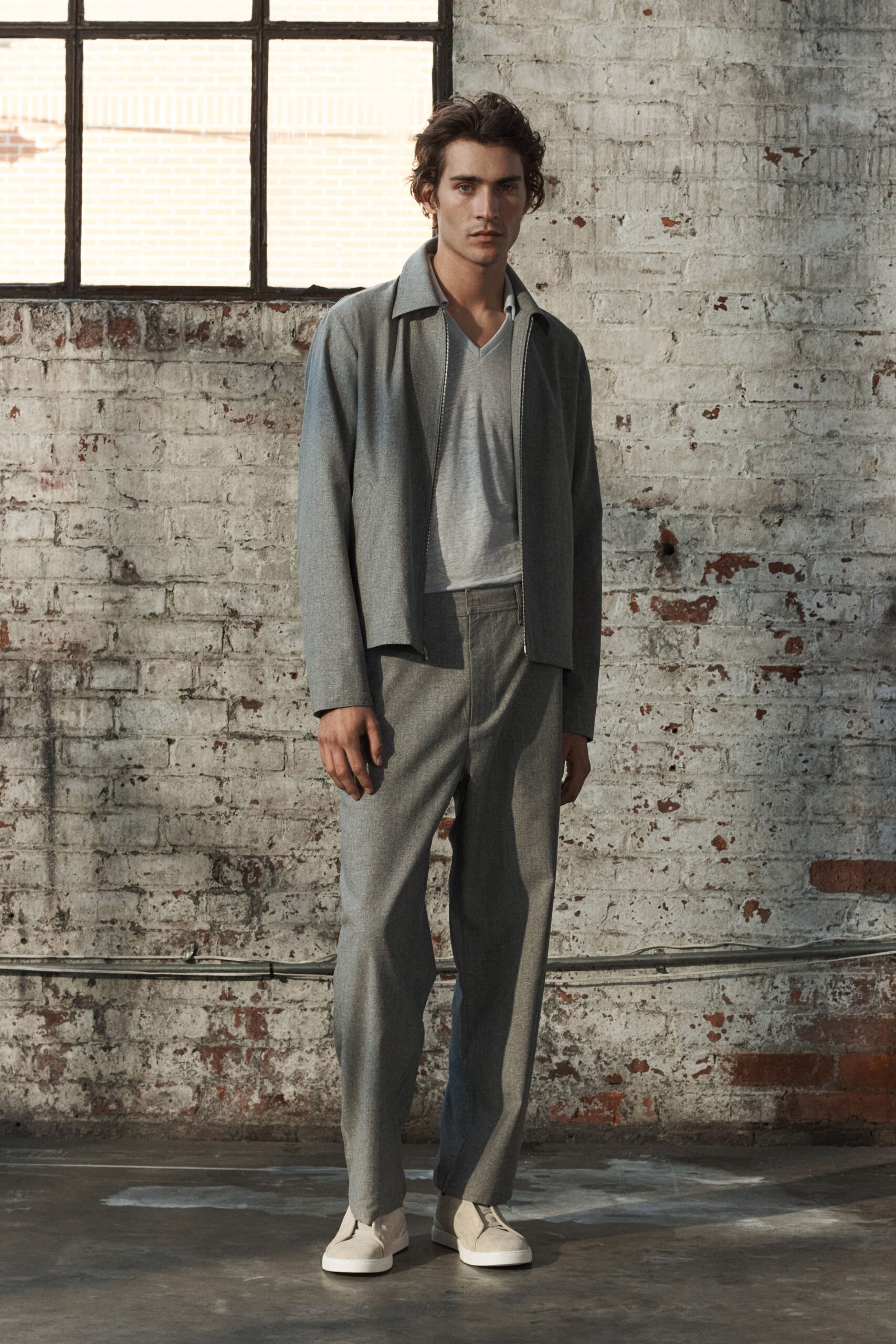 gray relaxed jacket with t-shirt and tailored pants