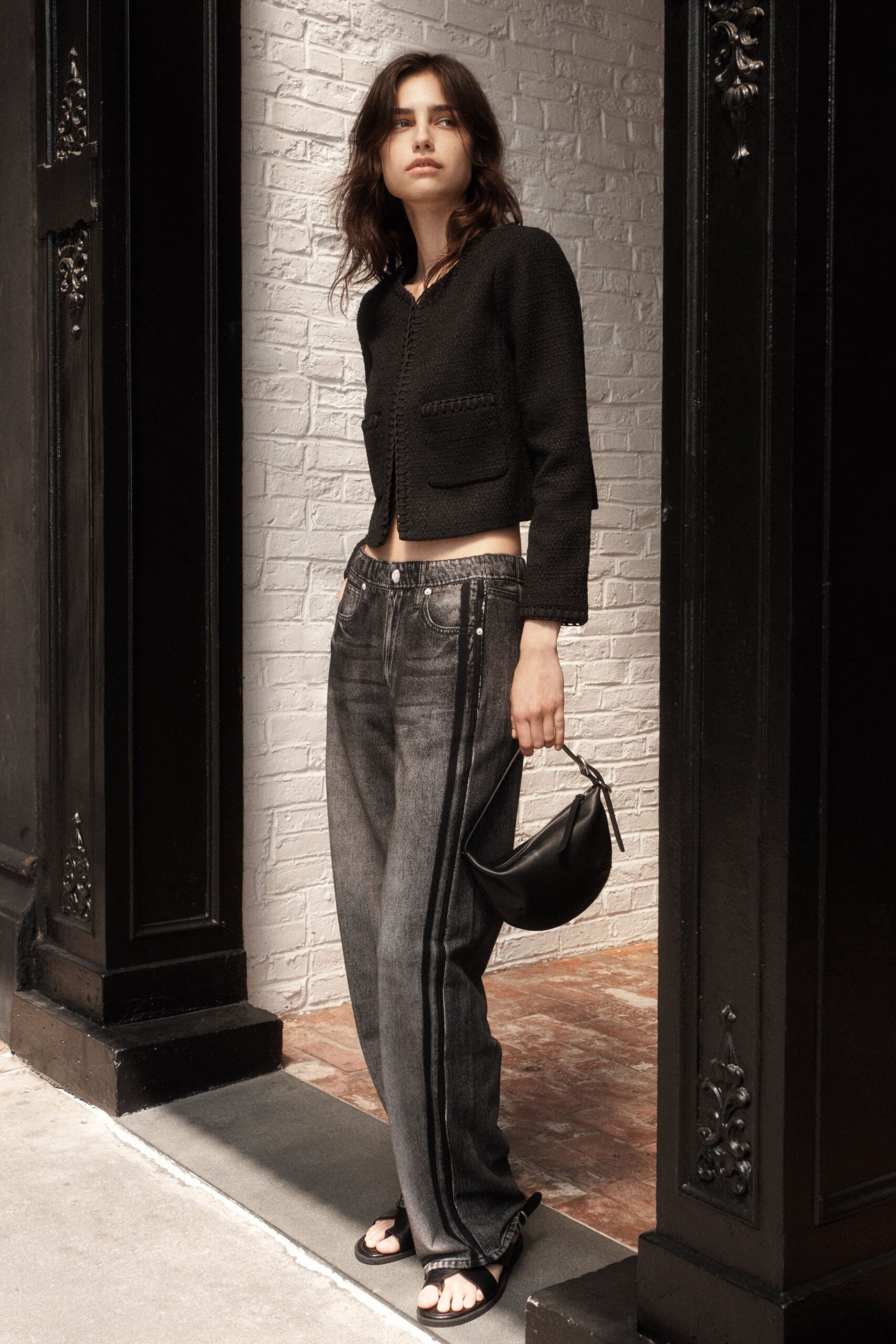 black fitted jacket with relaxed jeans
