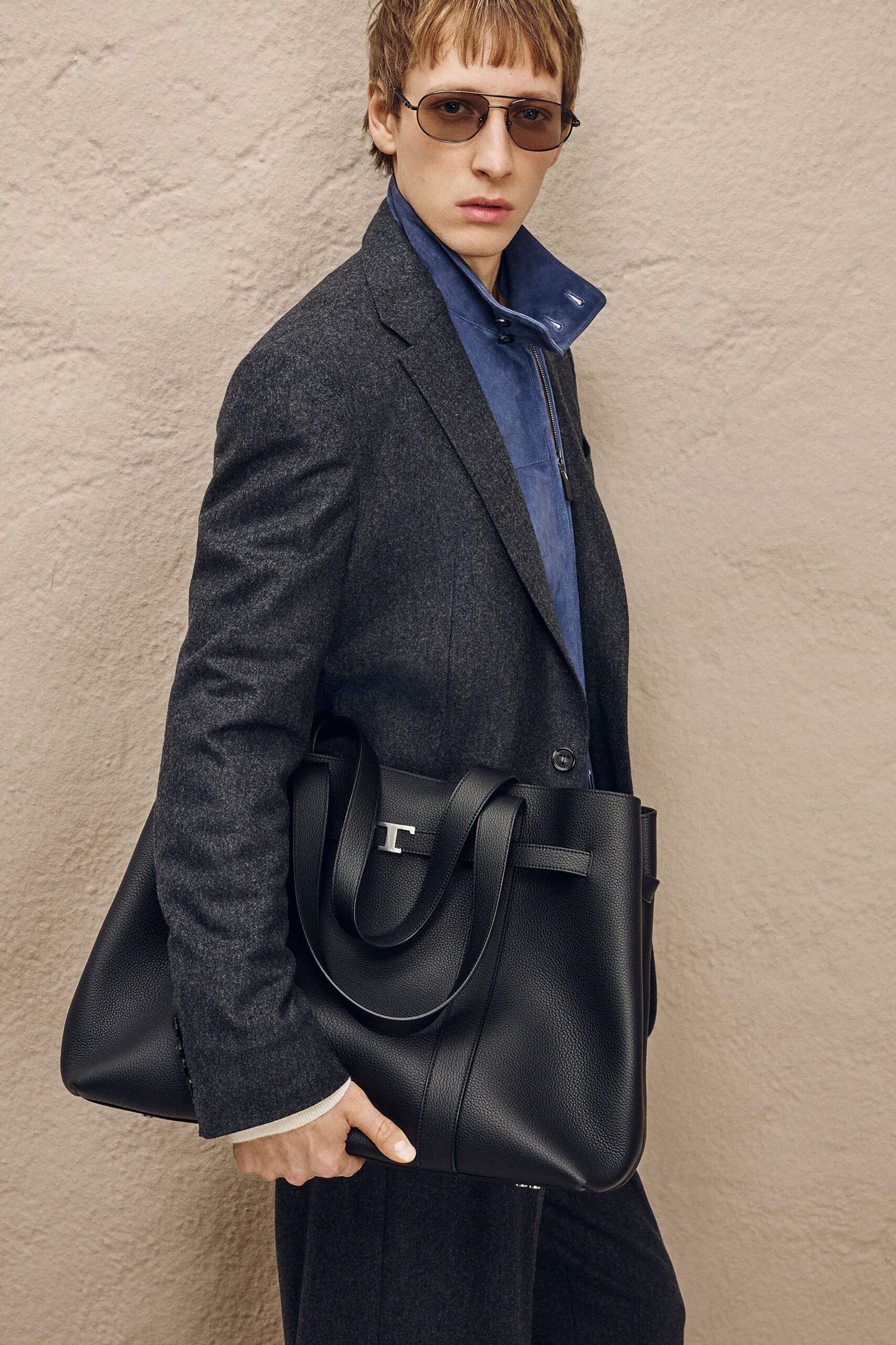 gray tailored suit with blue shirt