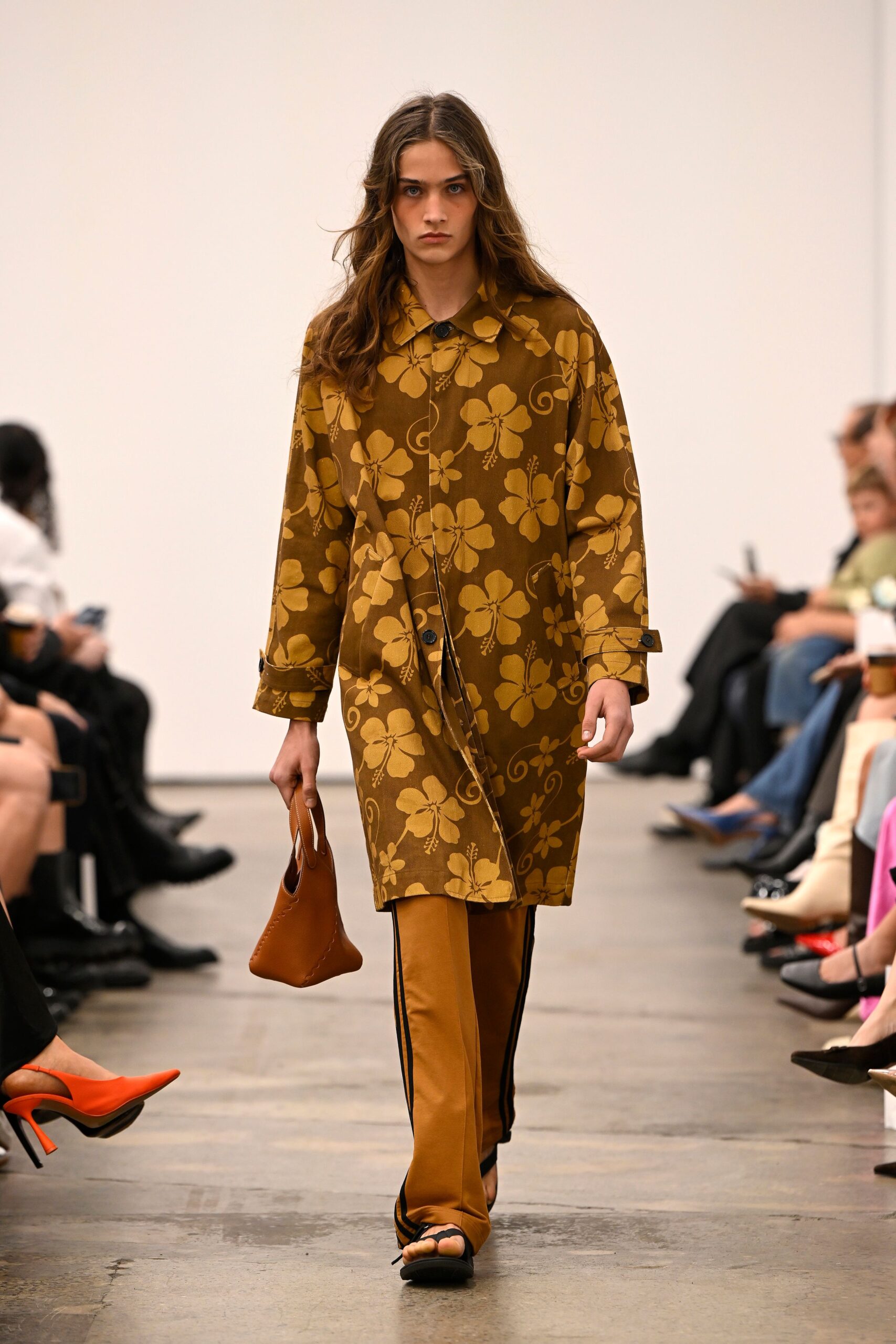 brown floral coat with orange pants
