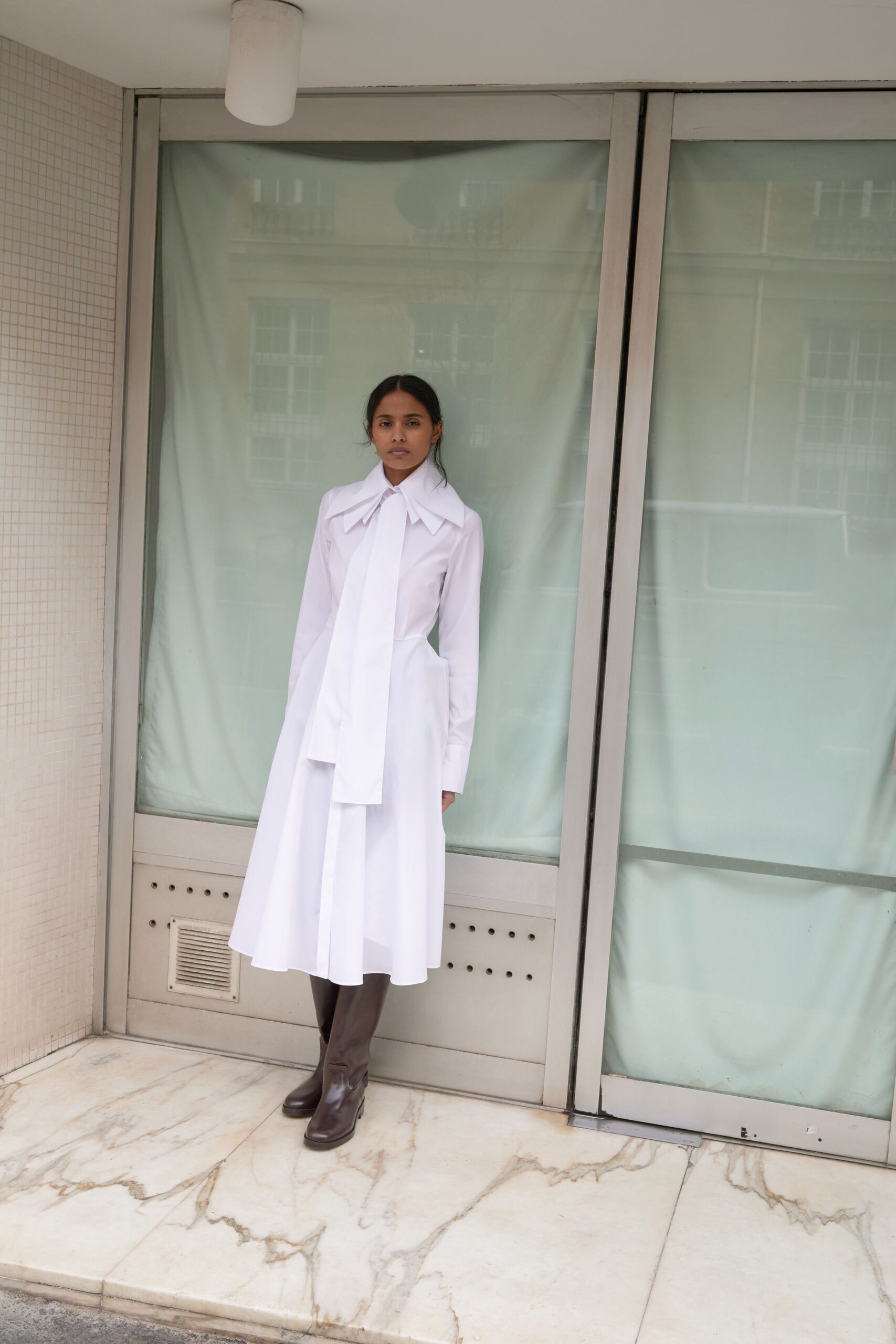 white cotton long-sleeve collared fitted buttoned tiered shirt-dress