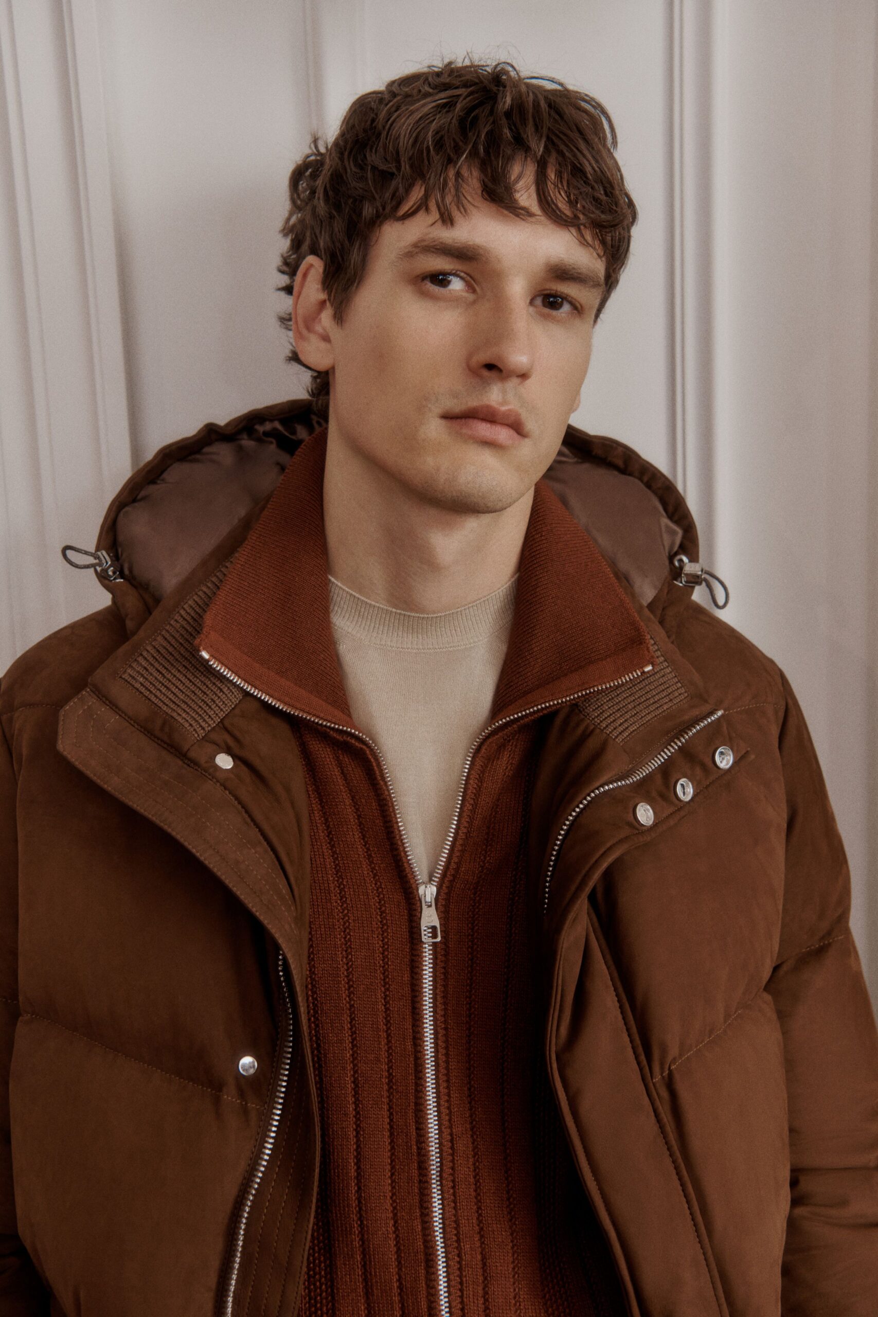 brown faux-fur jacket and beige sweater