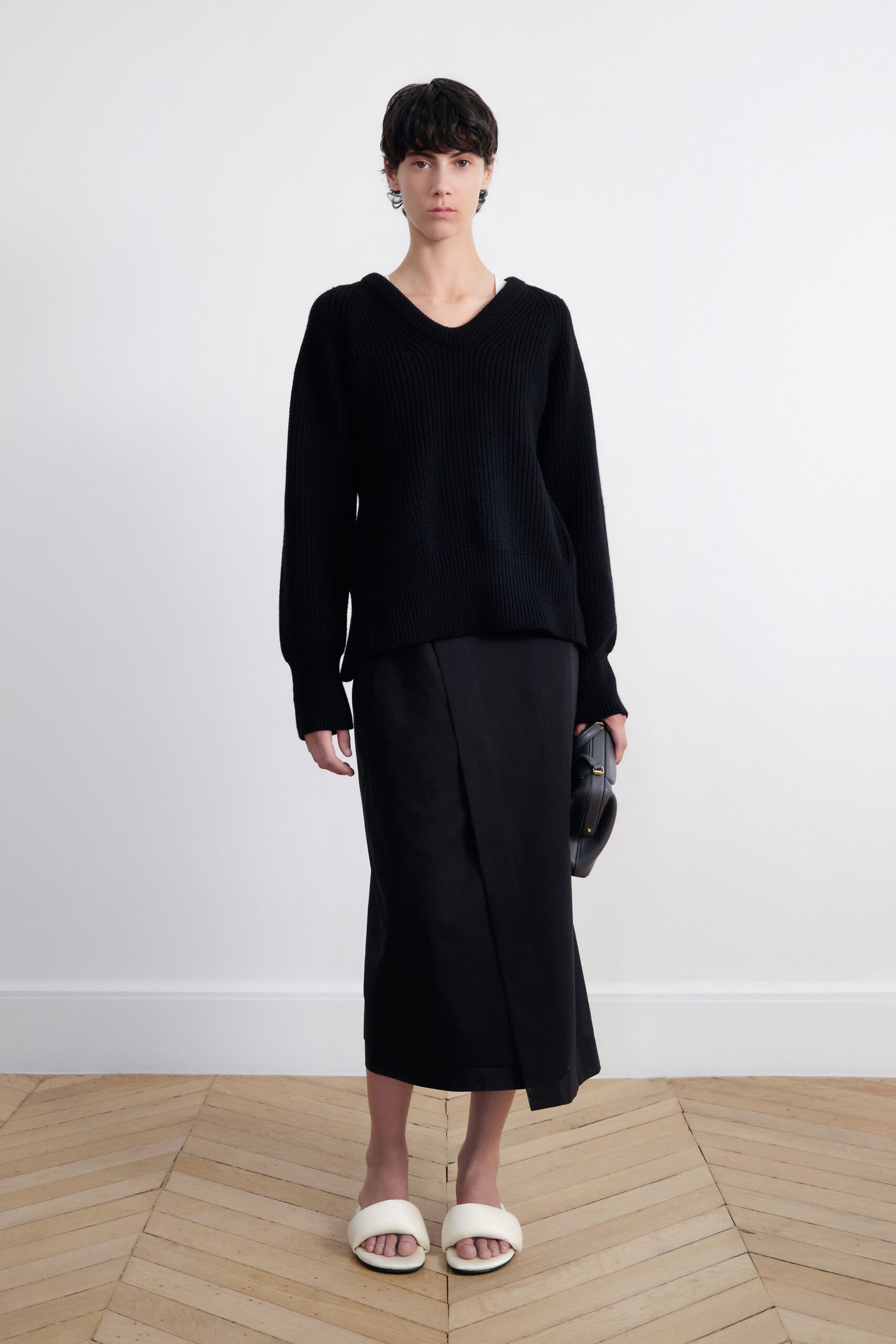 black sweater black midi skirt white shoes