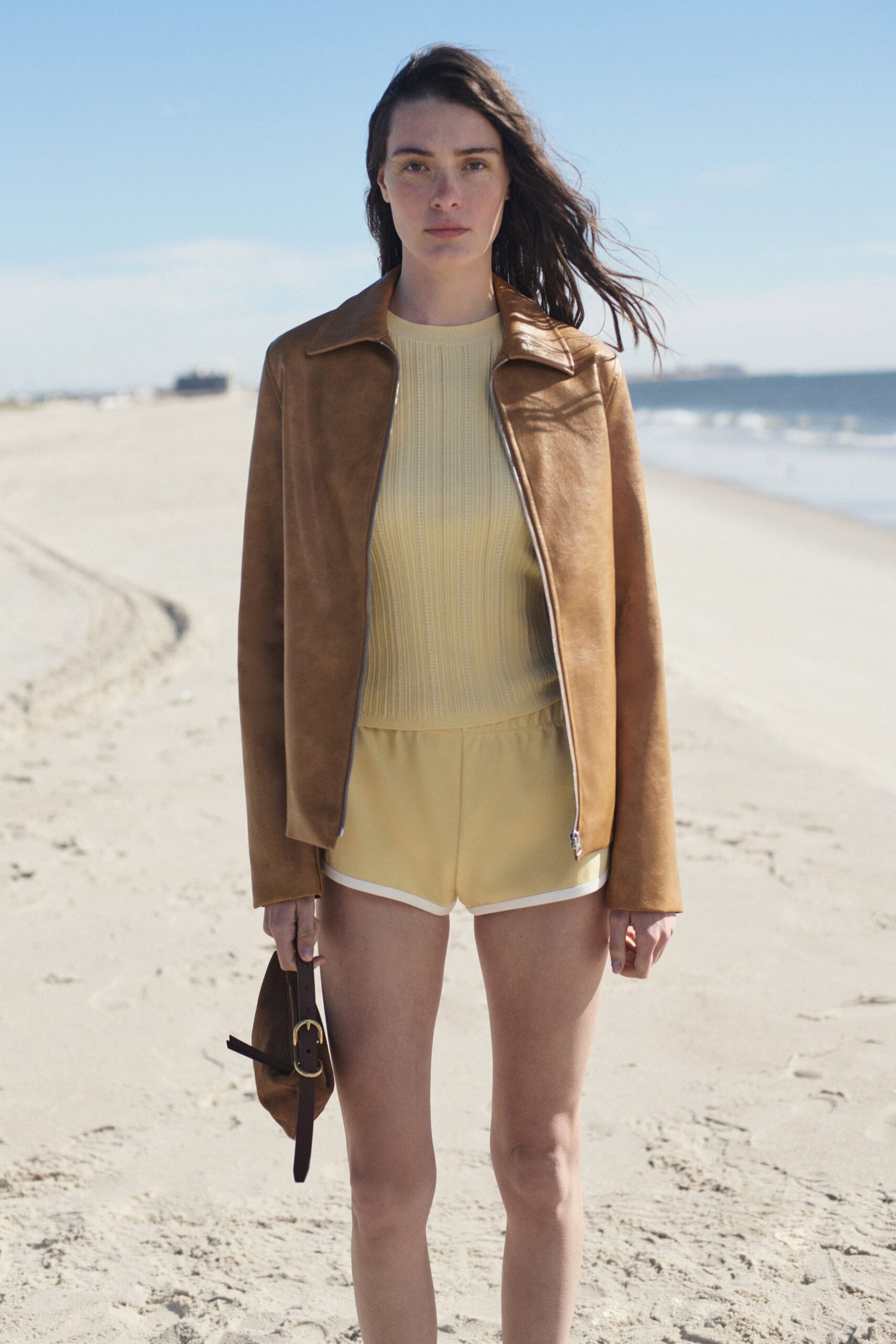 brown leather jacket with yellow top
