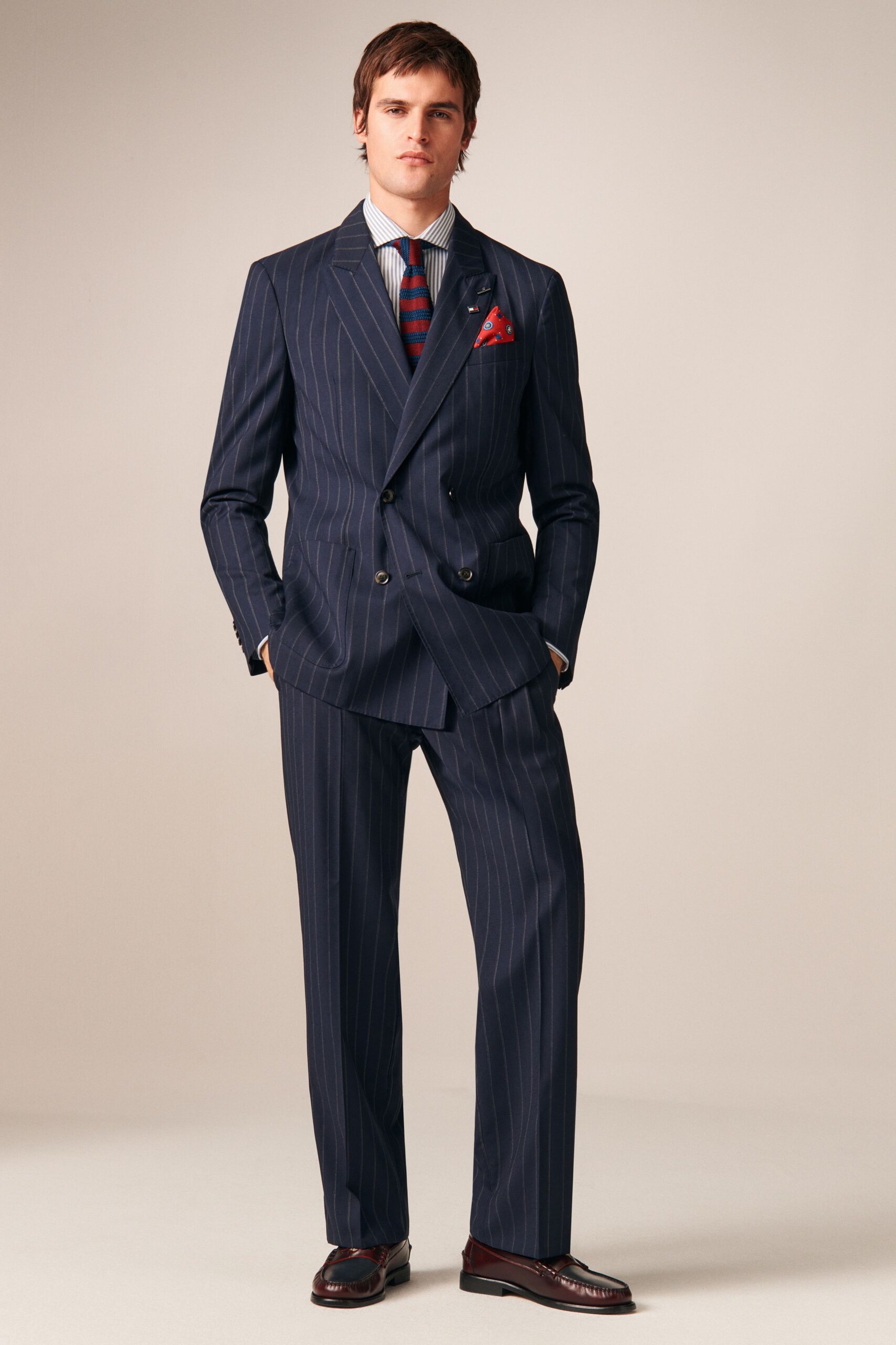 blue tailored suit with striped shirt