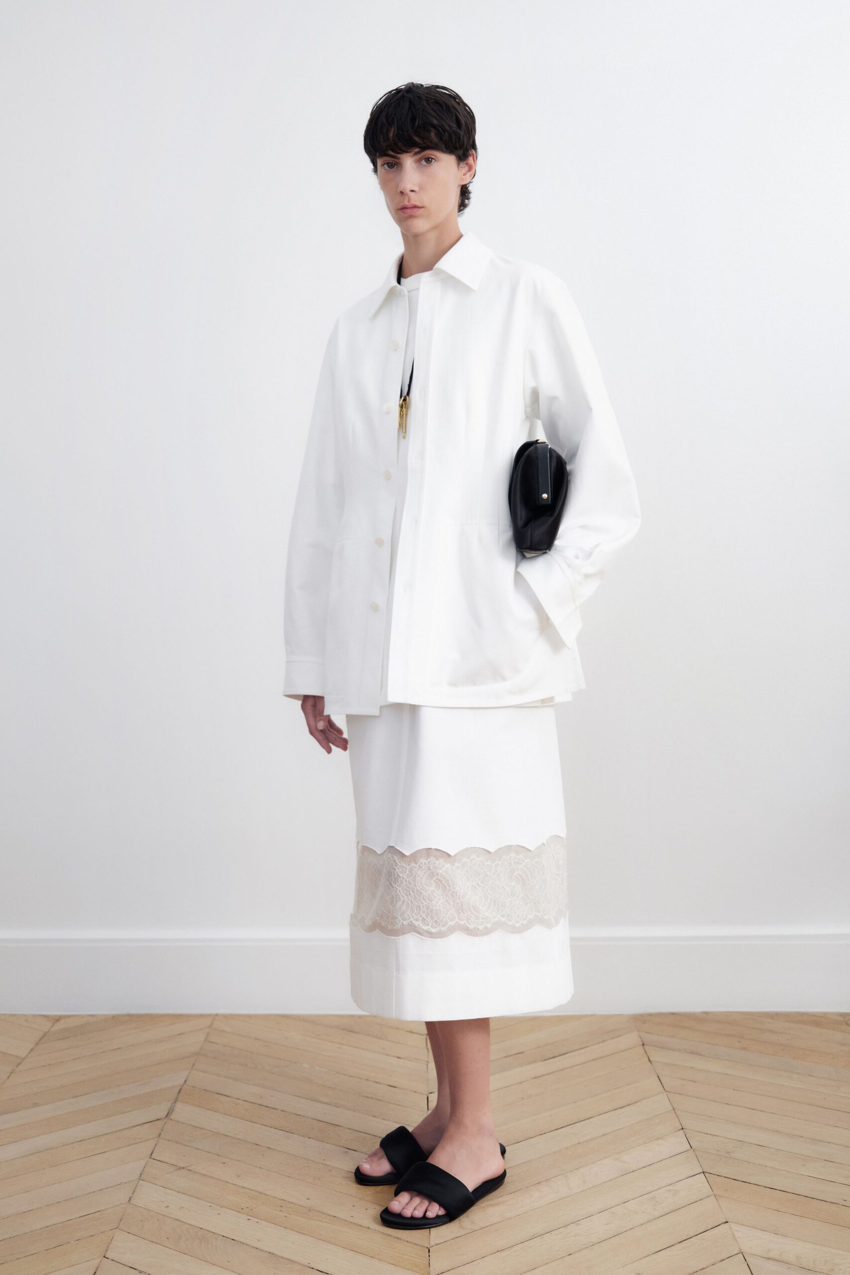 white relaxed jacket with black bag