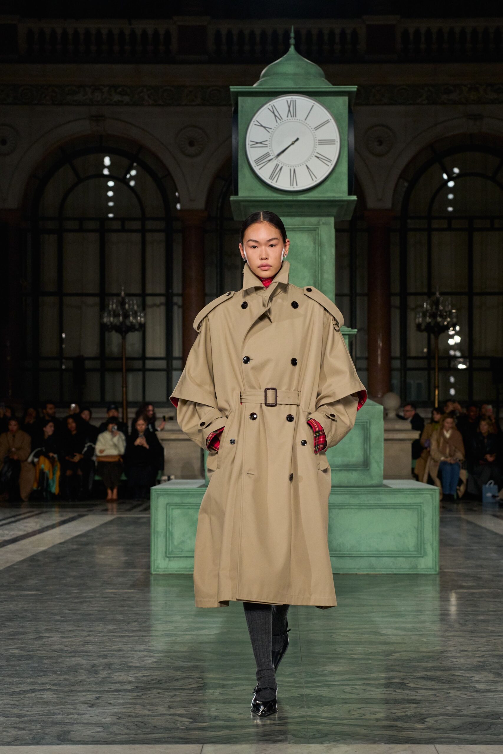 beige trench coat with black pants