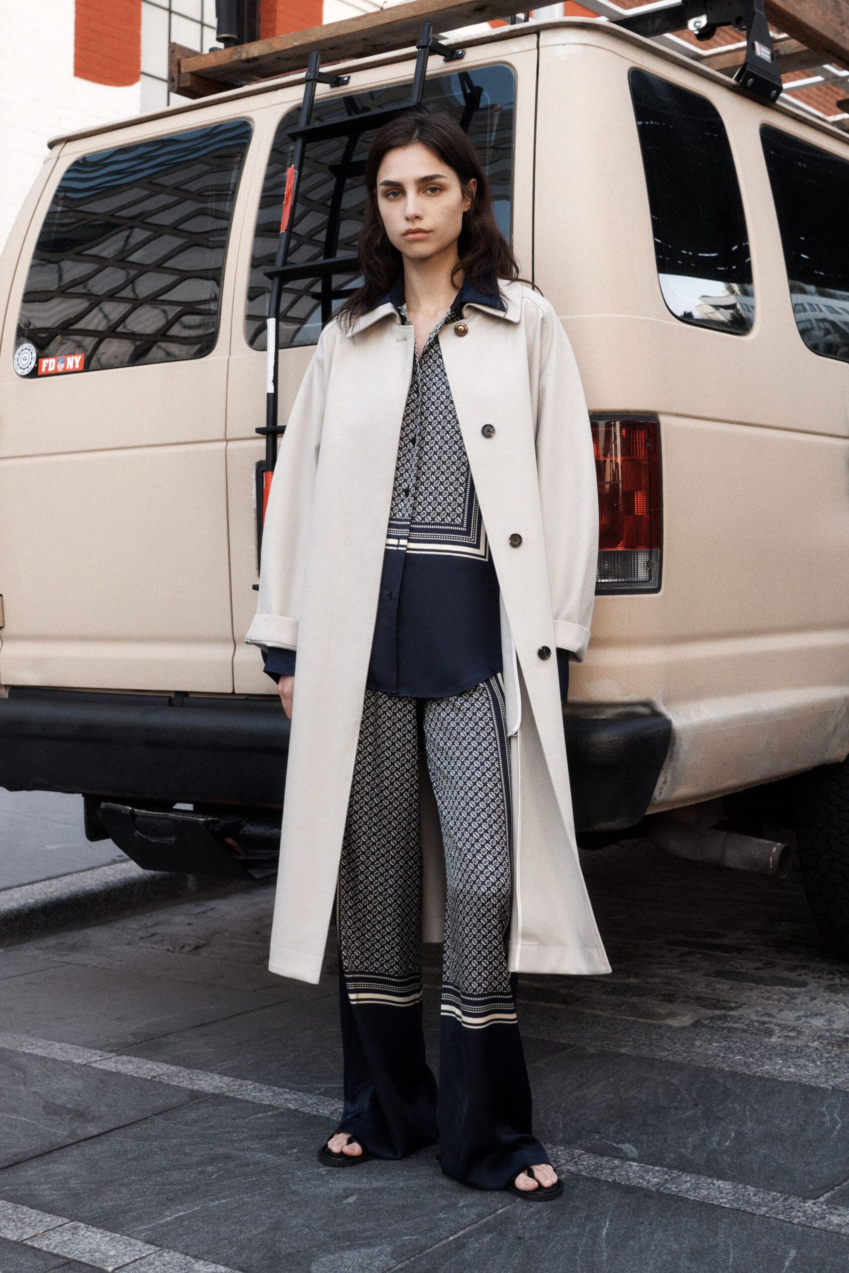 beige coat with printed shirt and pants