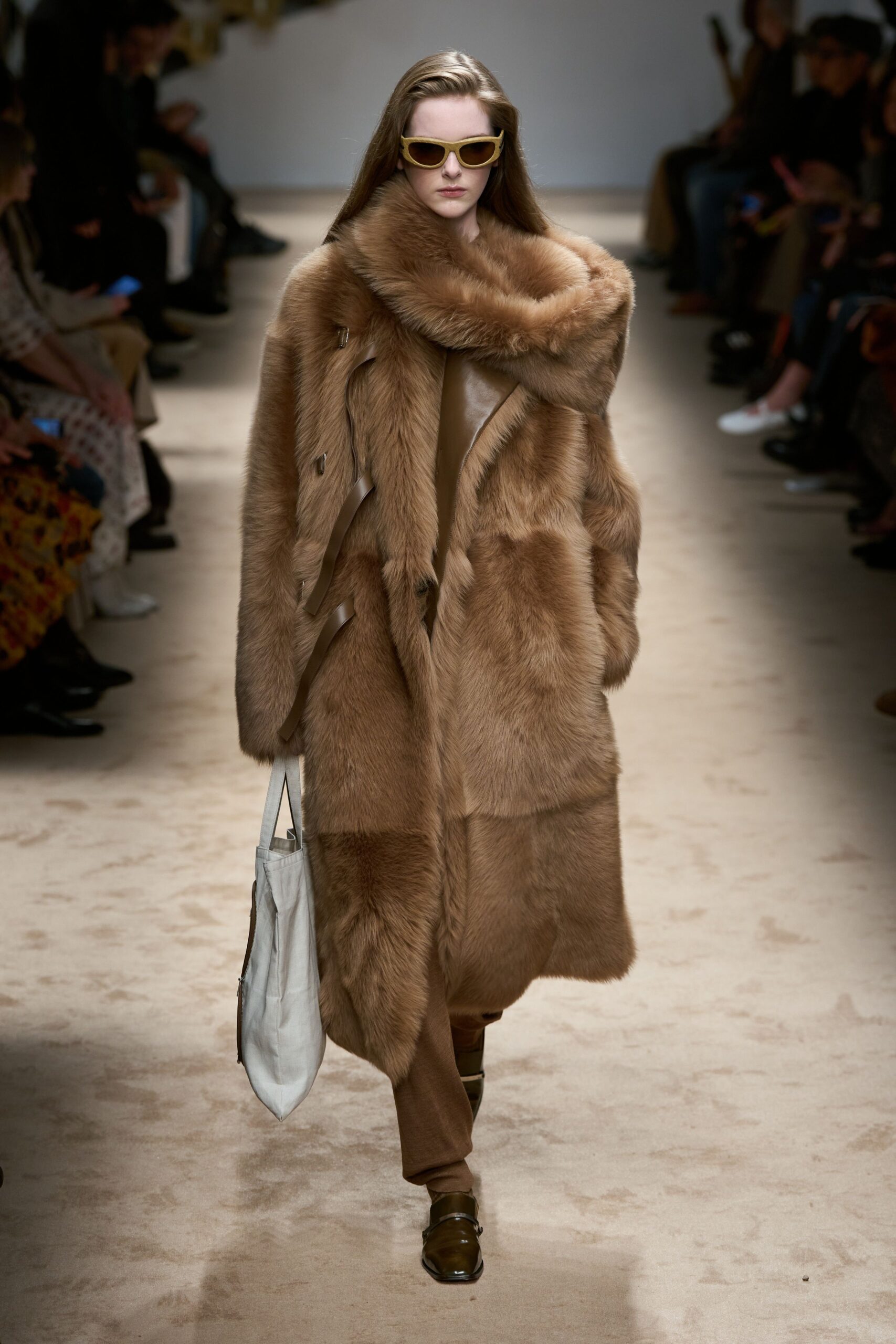brown fur coat with beige pants