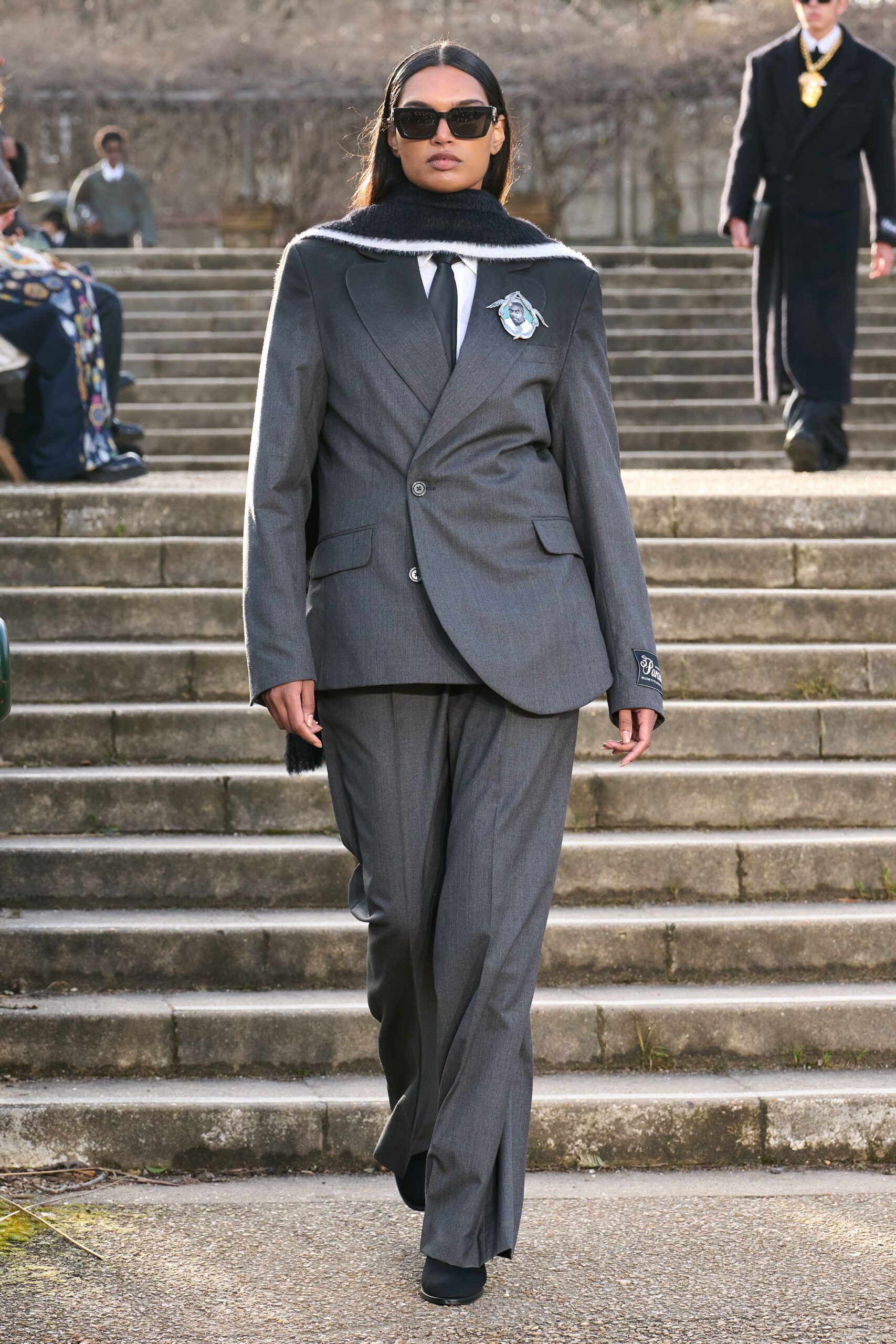 gray tailored suit with scarf