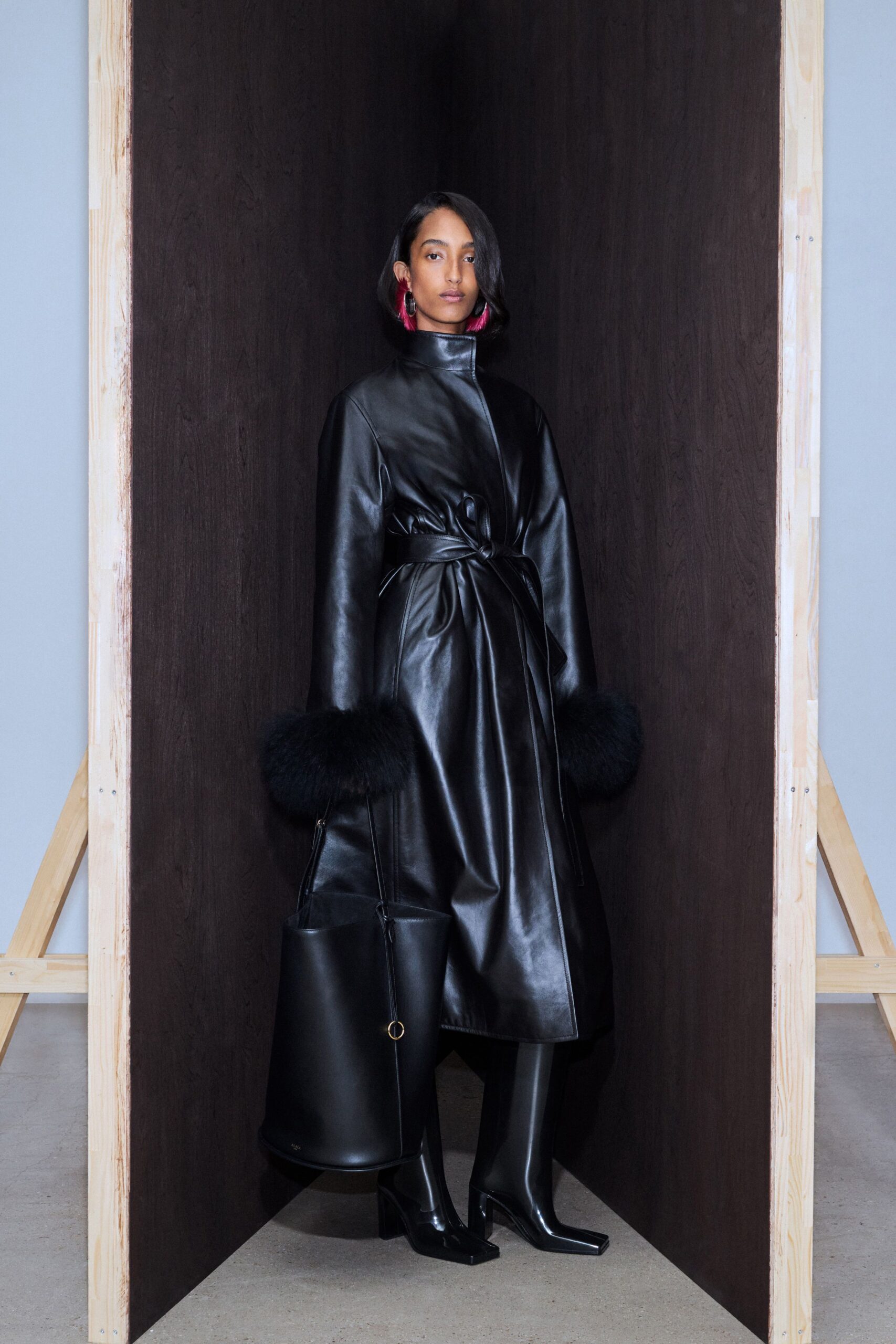 black leather long-sleeve collared fitted belted coat