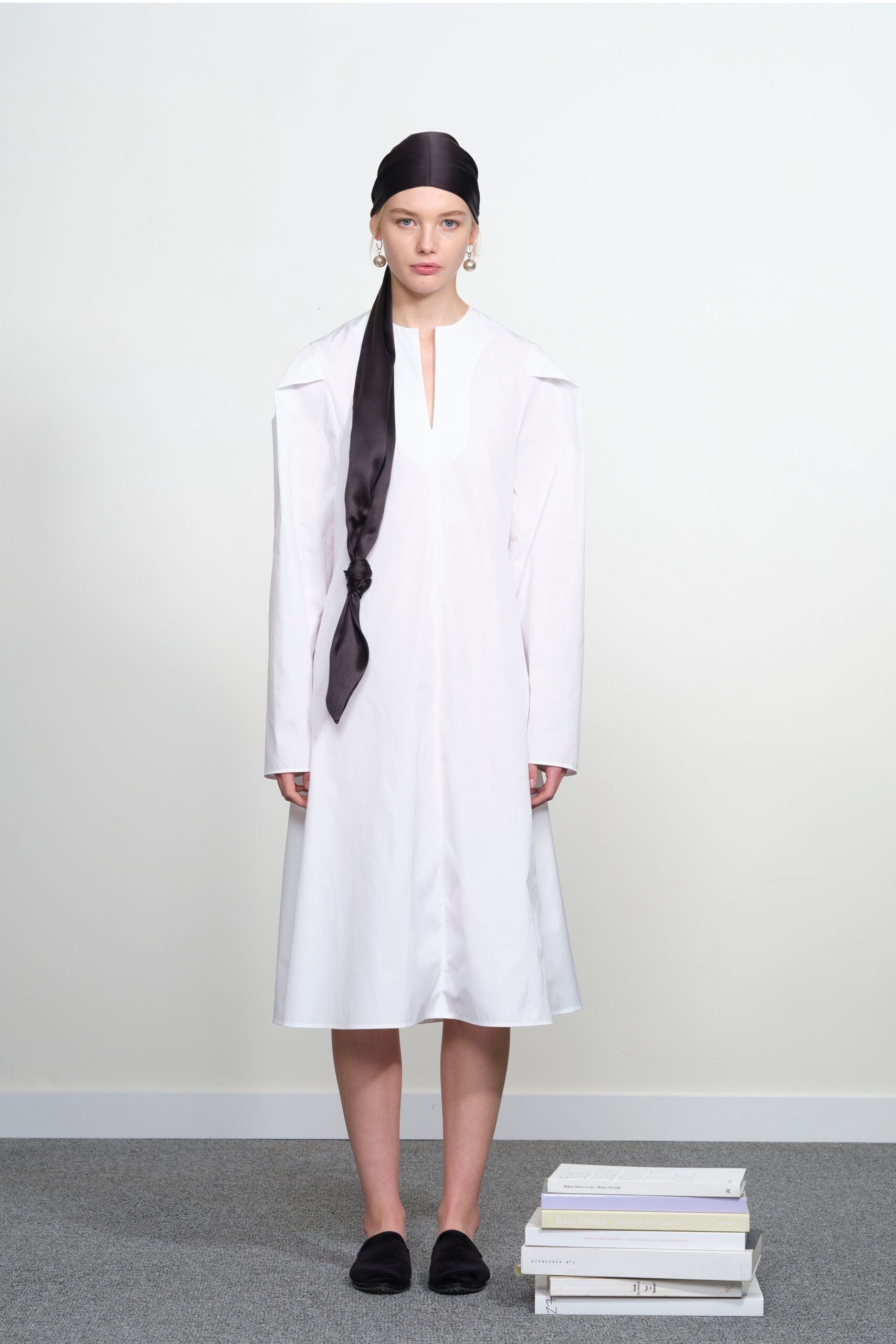 white midi dress with black scarf