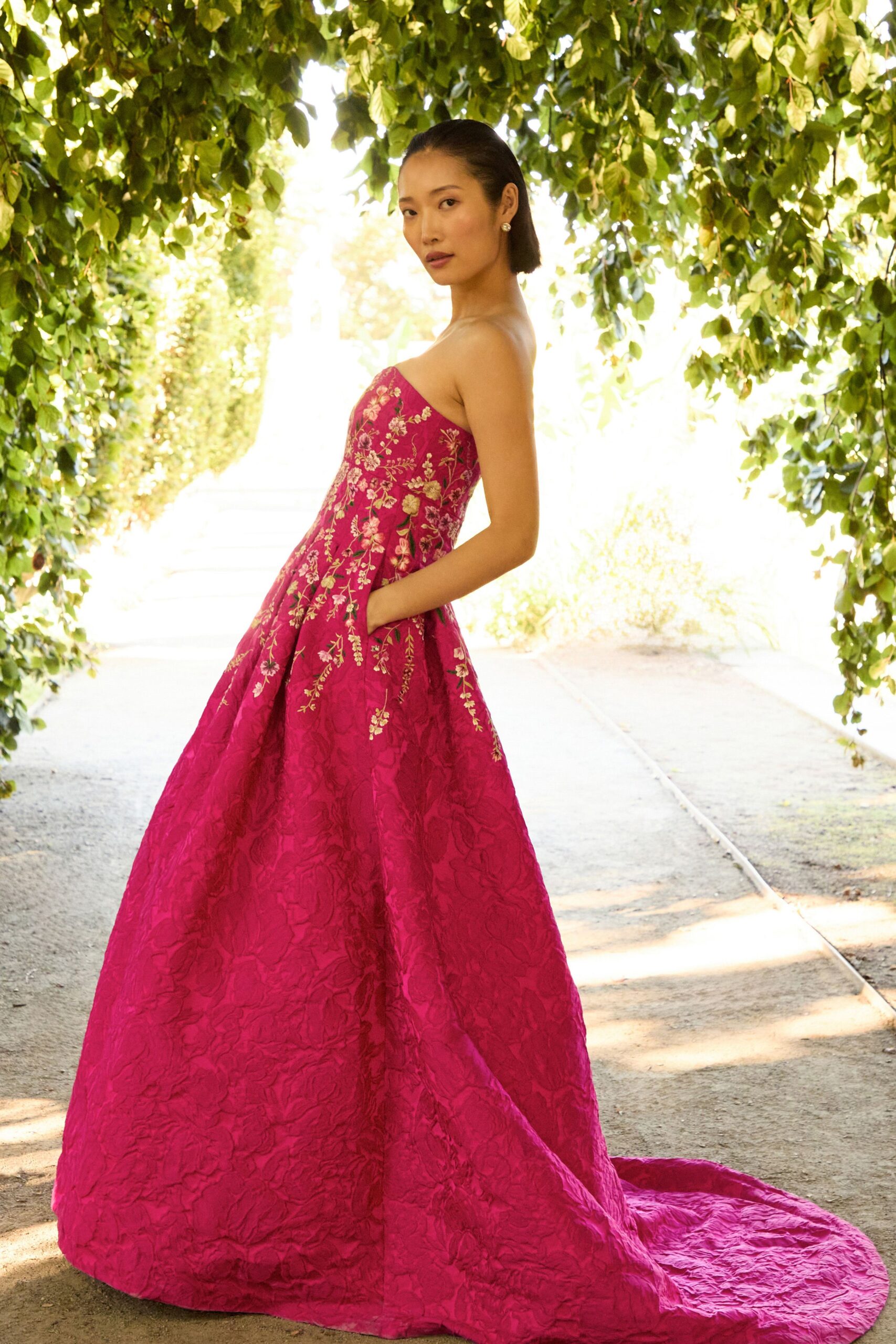 pink embroidered strapless gown