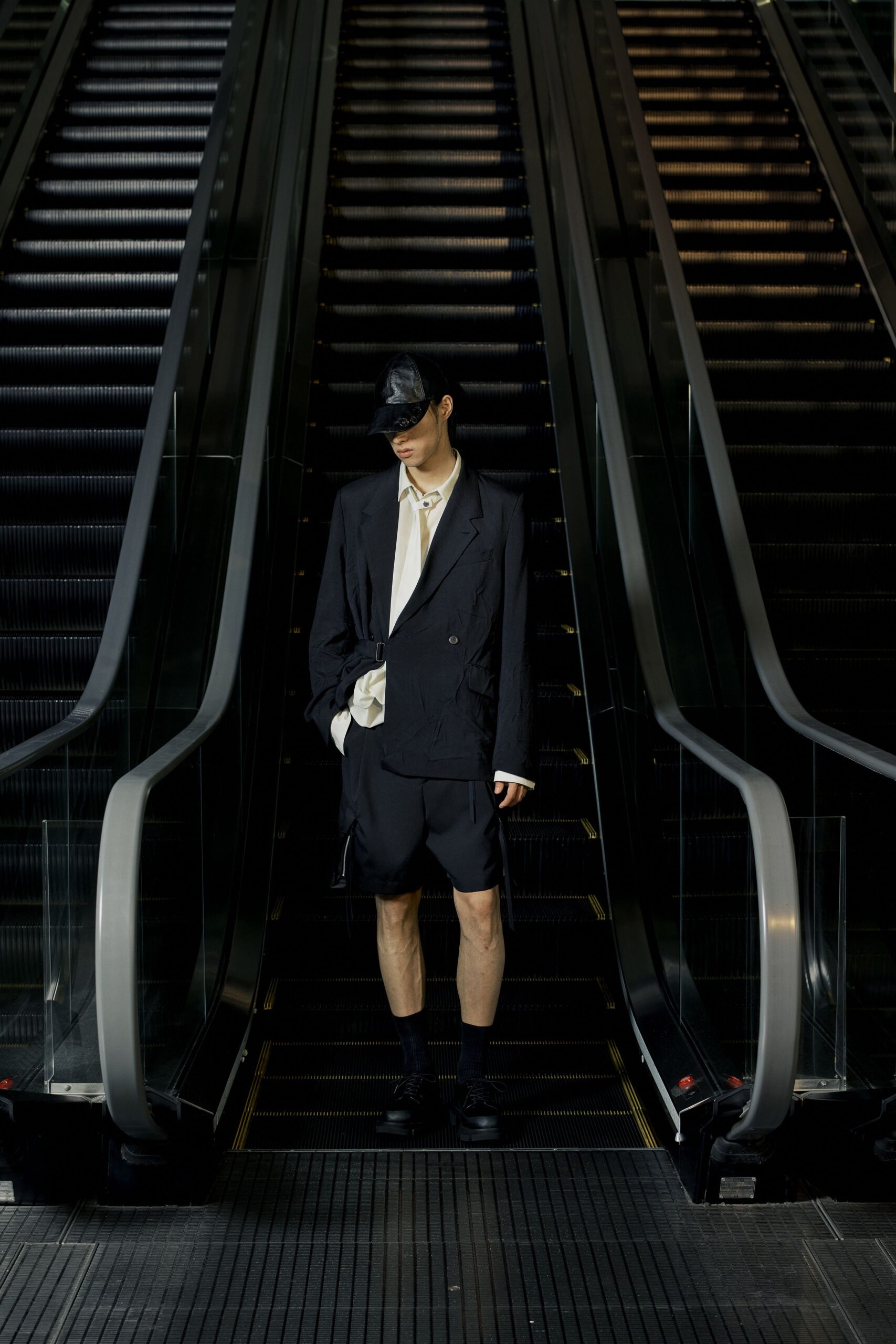 black blazer white shirt black shorts