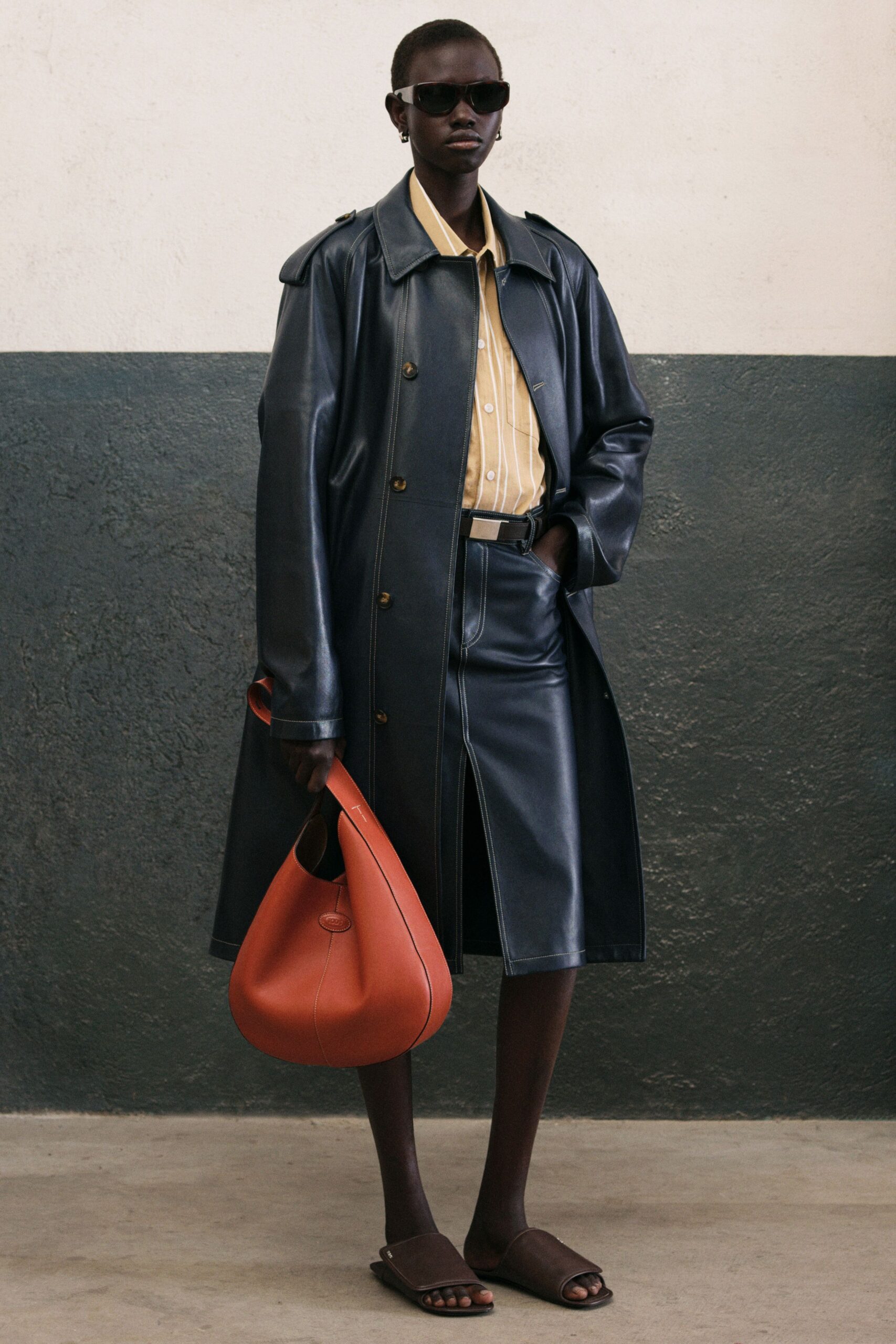 blue leather coat with yellow shirt