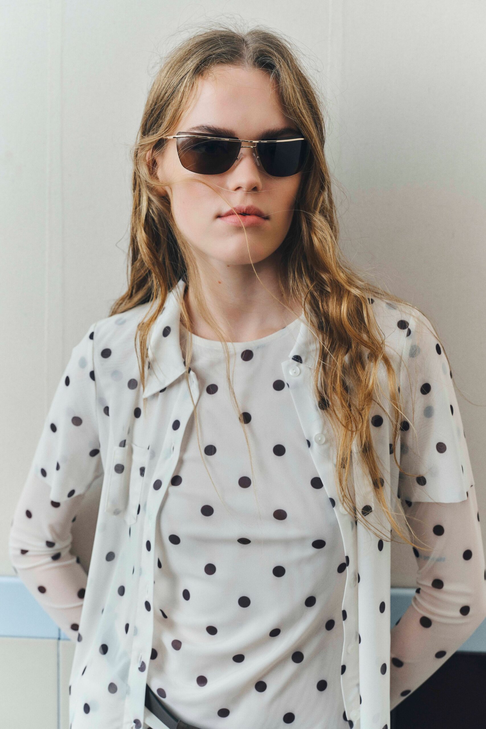 polka-dot sheer shirt and sunglasses