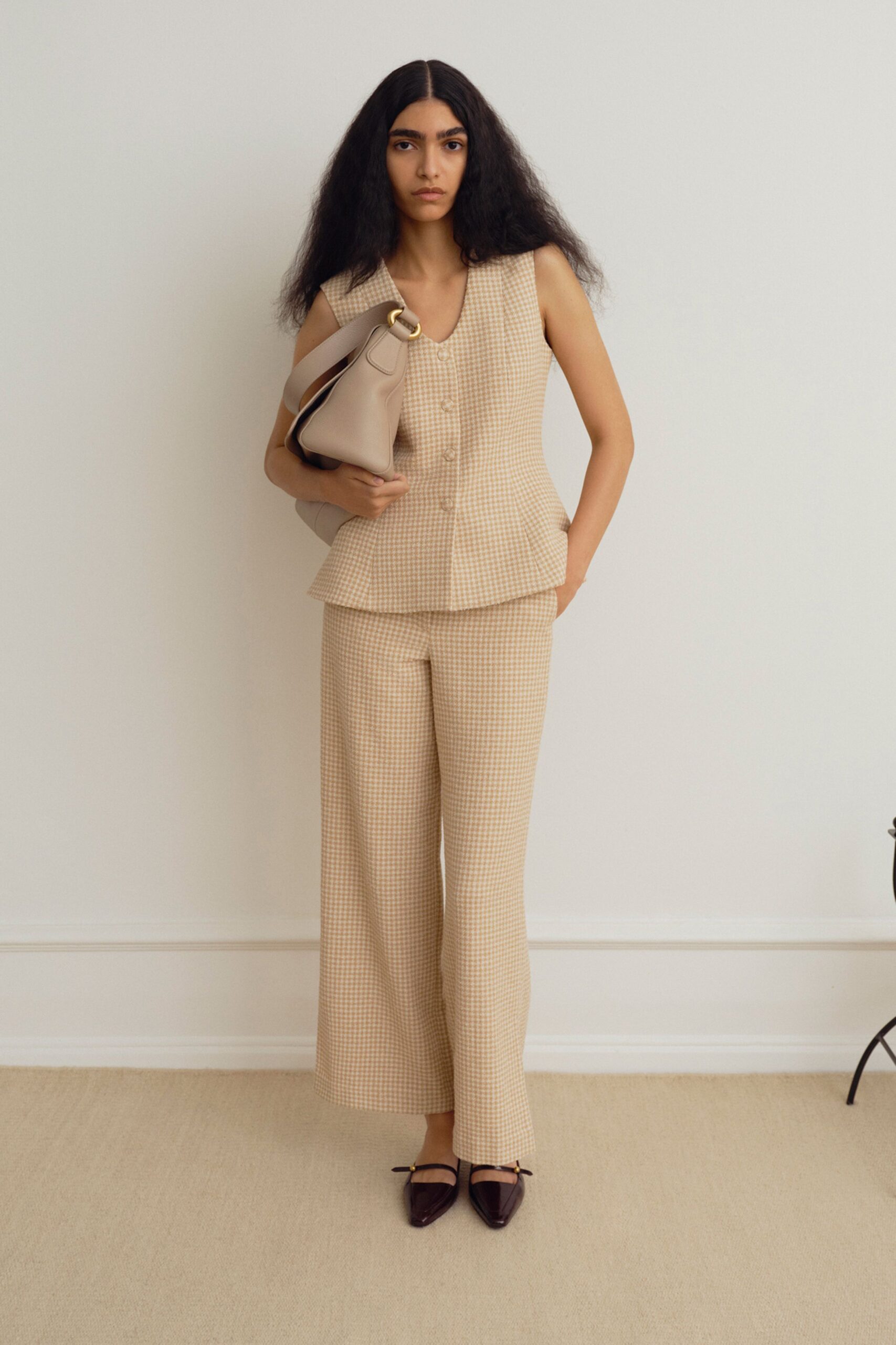 beige sleeveless top with wide-leg pants