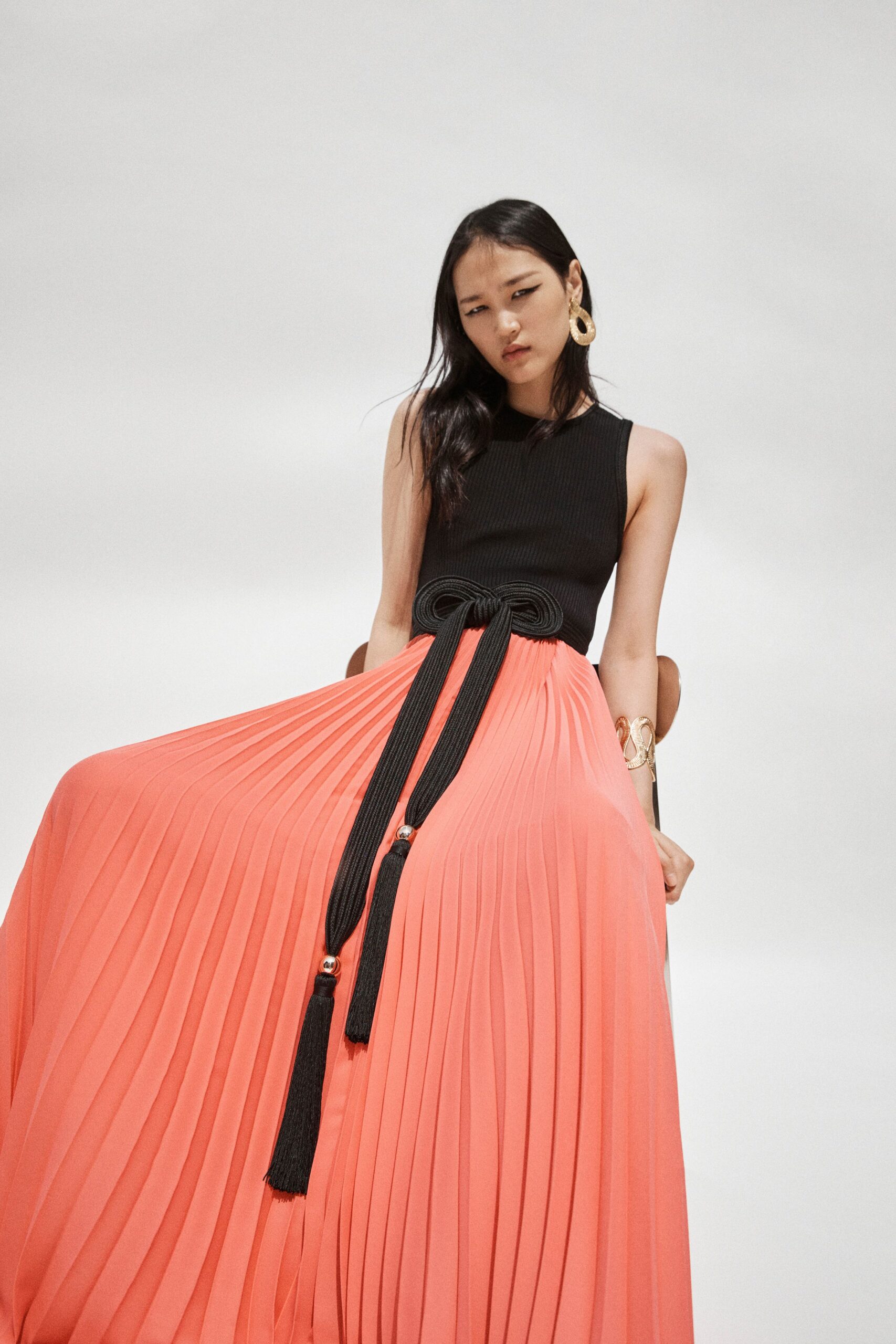 black and coral pleated dress