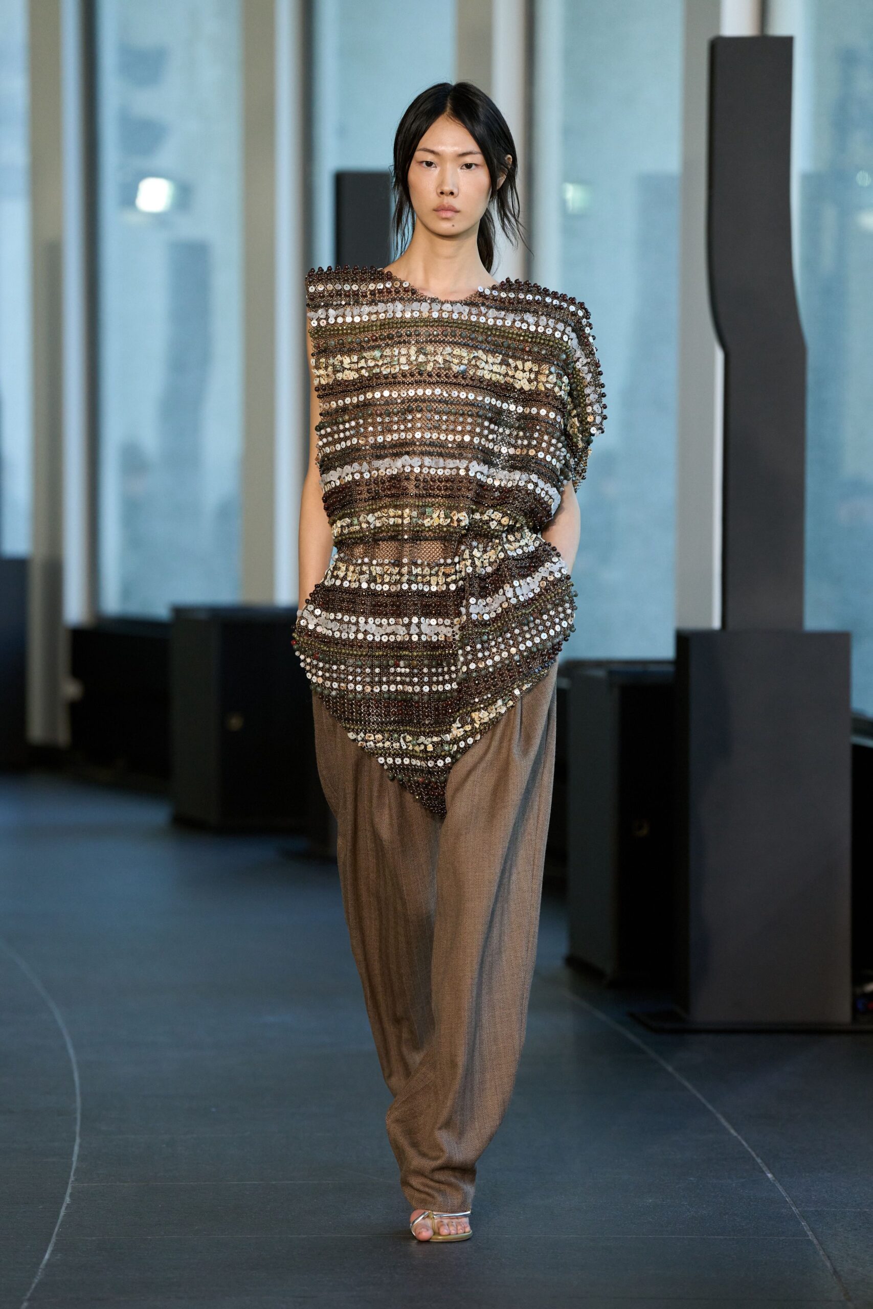 brown embellished top with beige pants