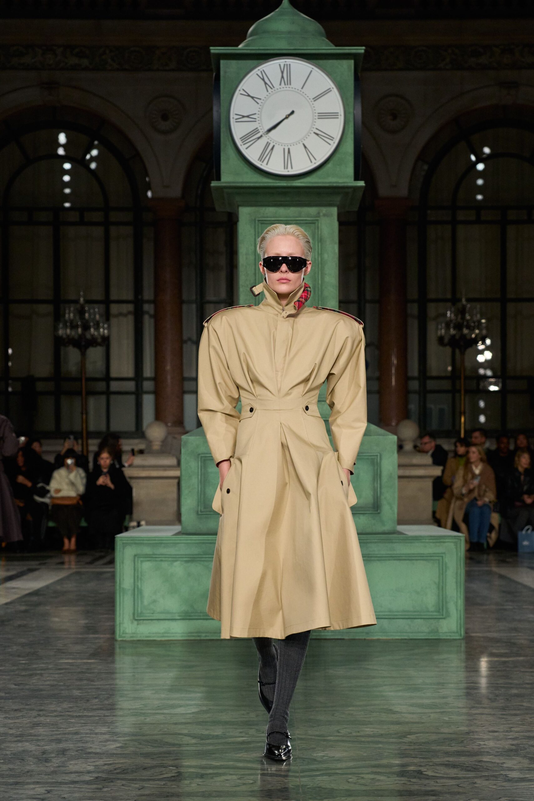 beige fitted coat with sunglasses