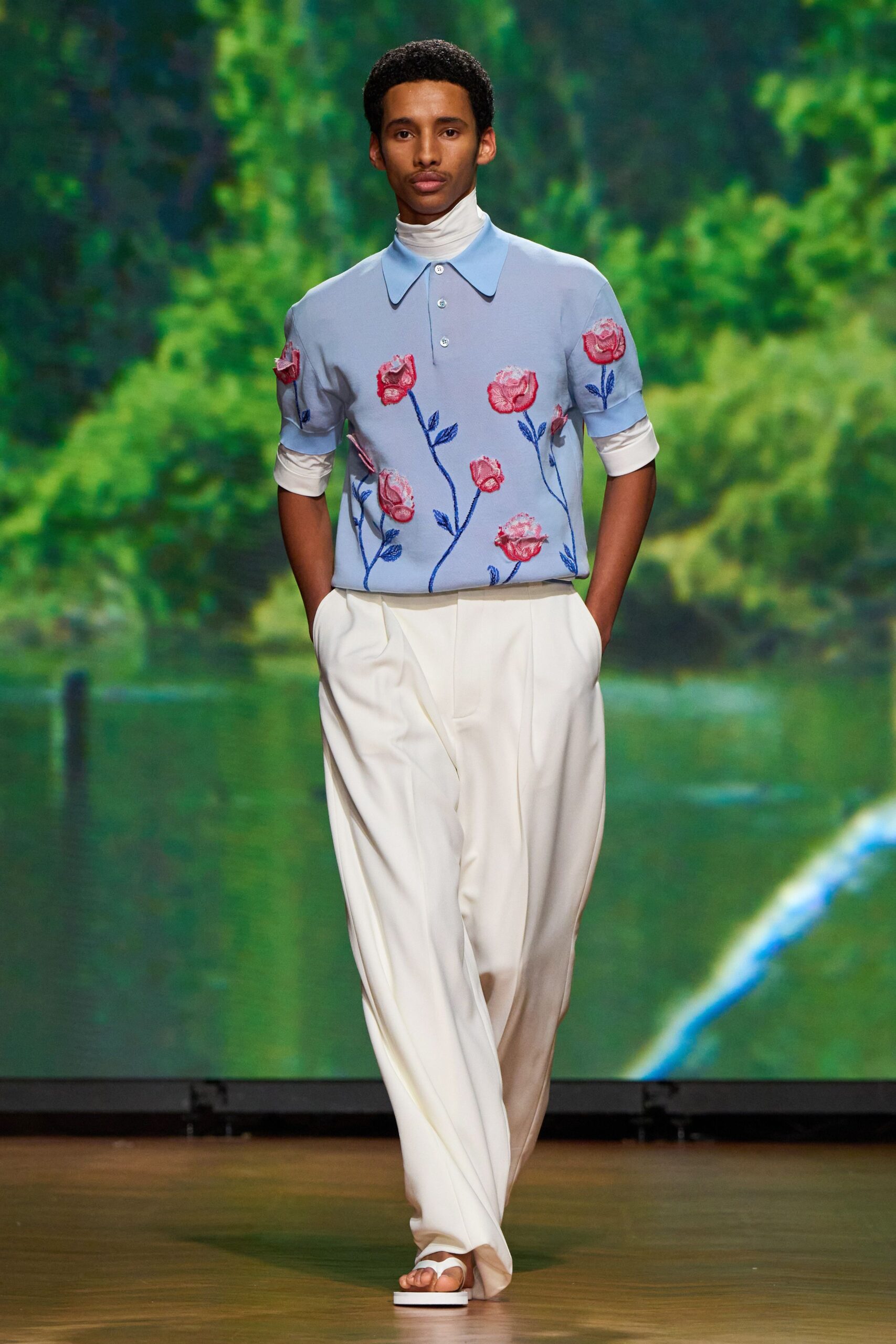 blue embroidered top with white pants