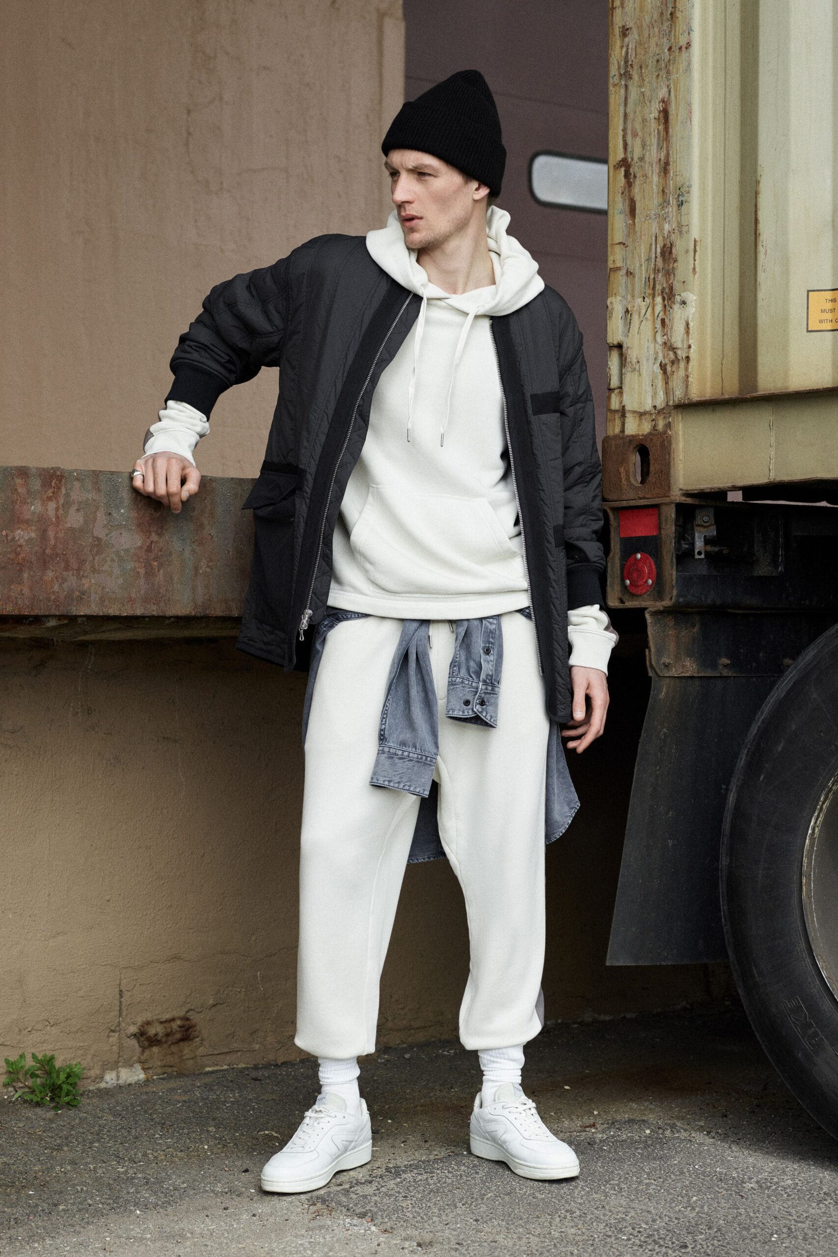 black jacket white hoodie relaxed outfit