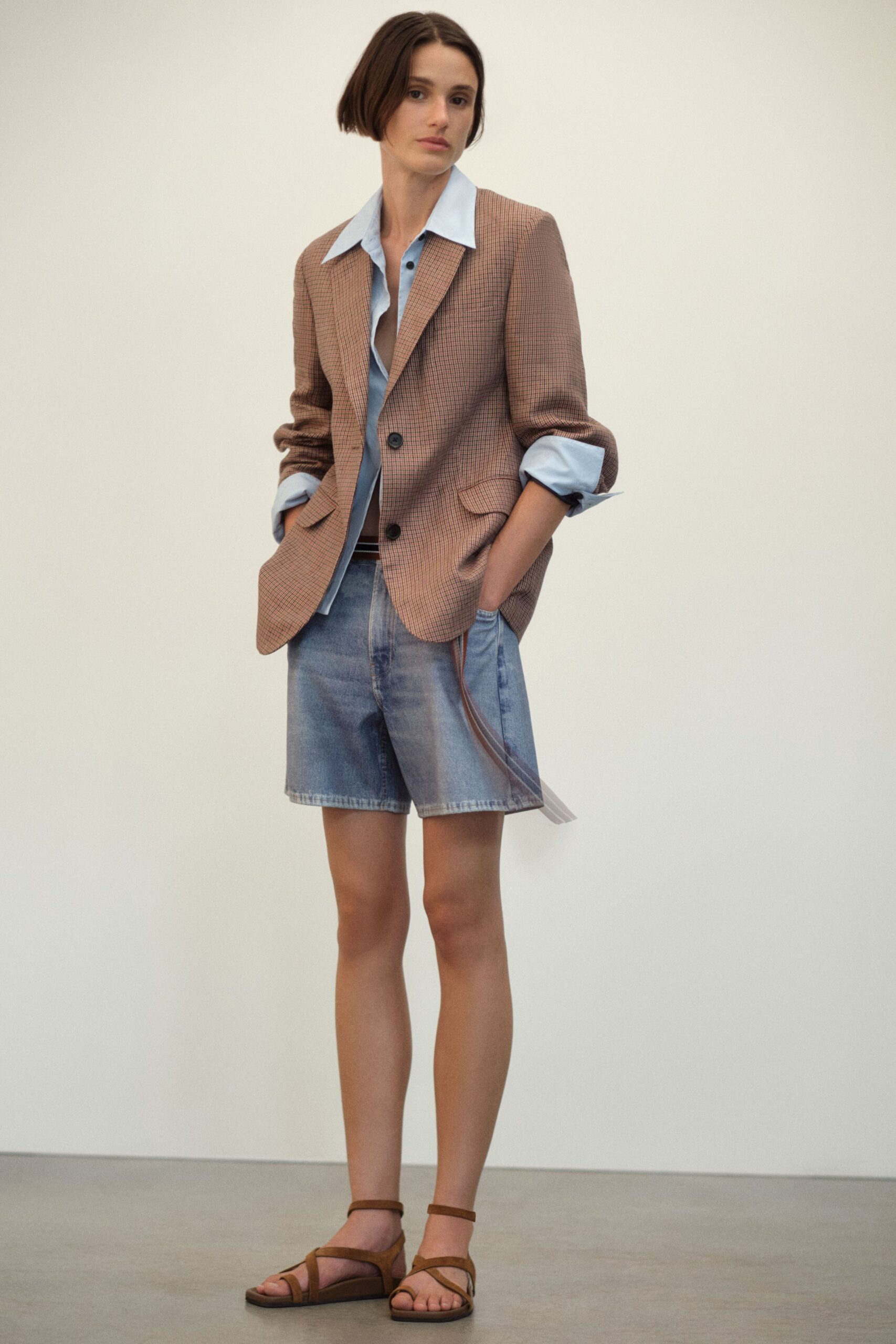 brown tailored blazer with blue shirt