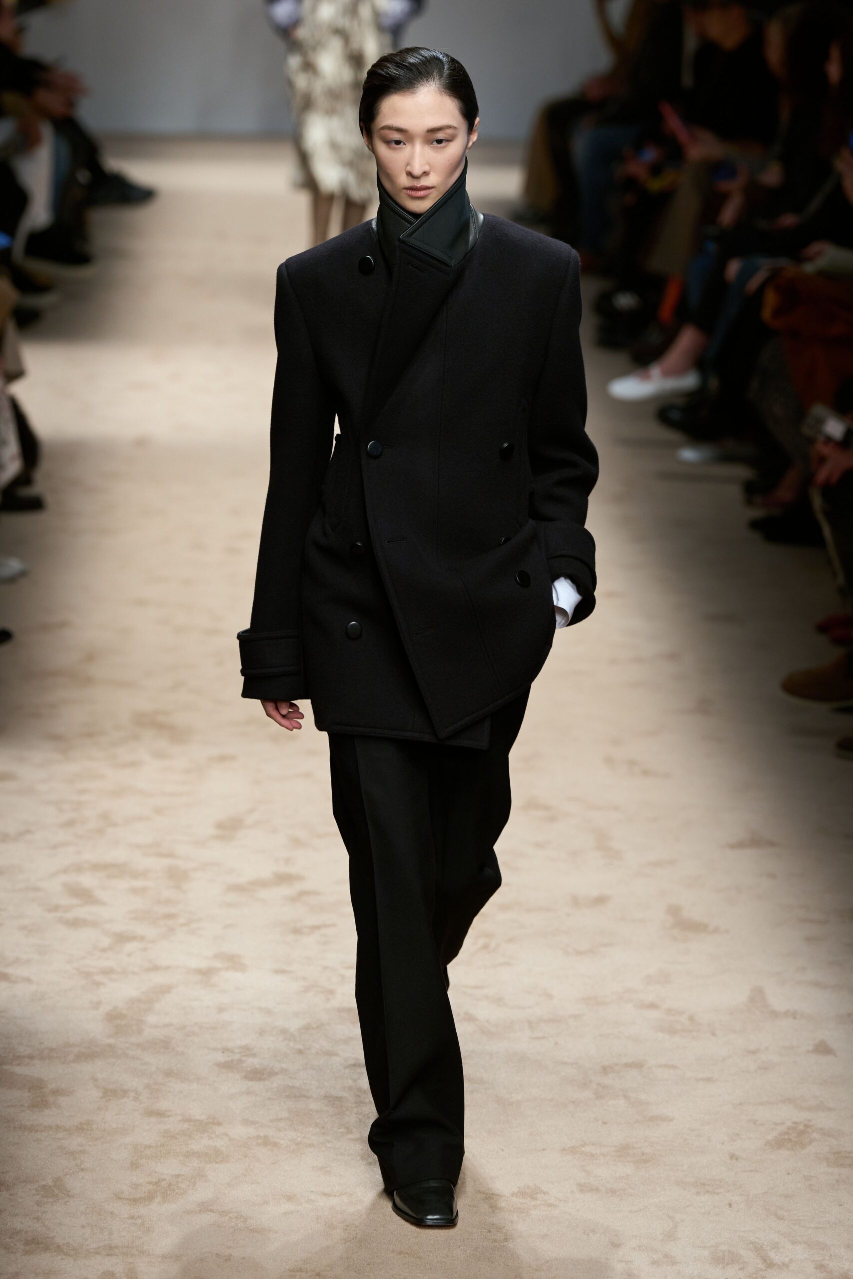 black wool coat and tailored pants