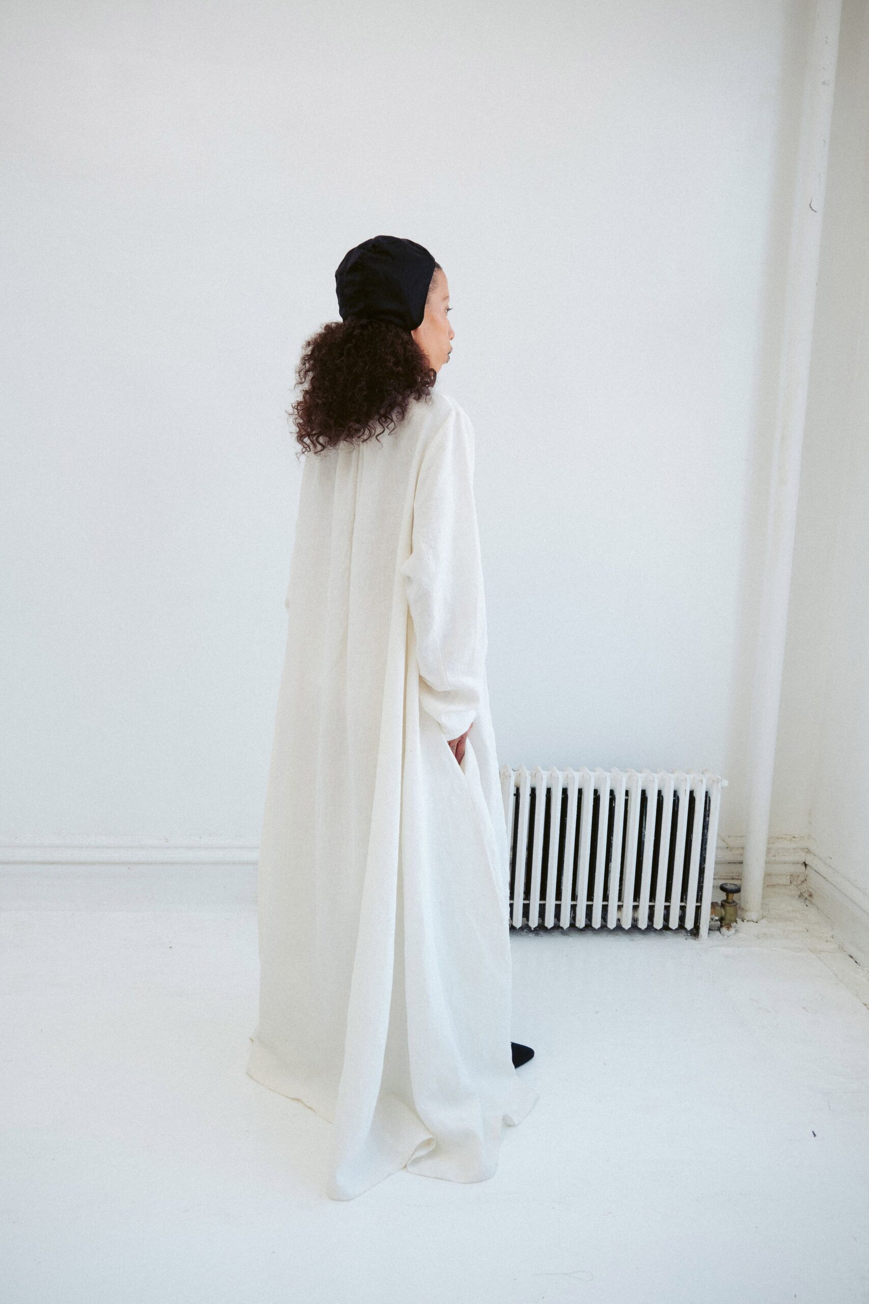 white relaxed maxi dress with black hat