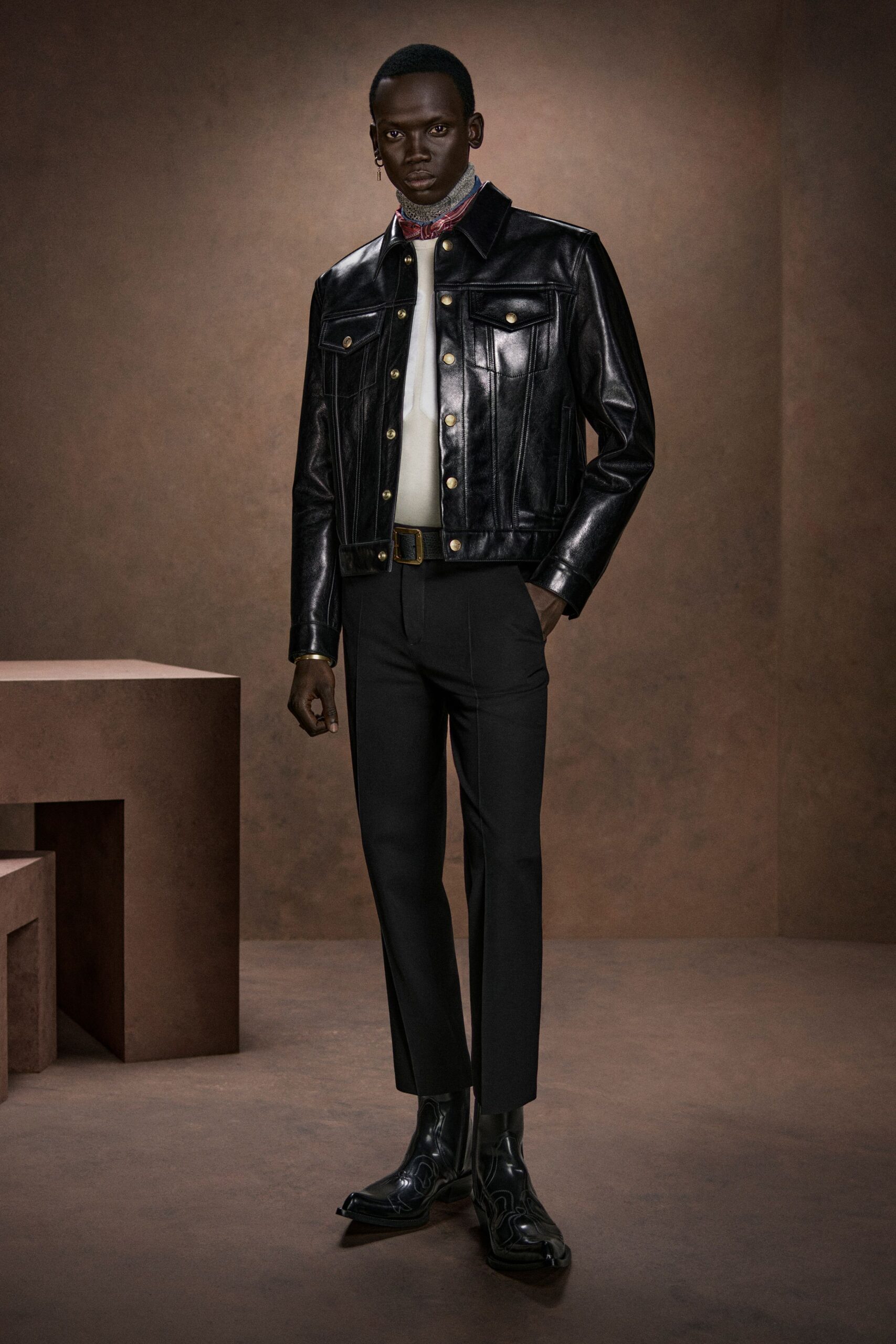black leather jacket with tailored pants