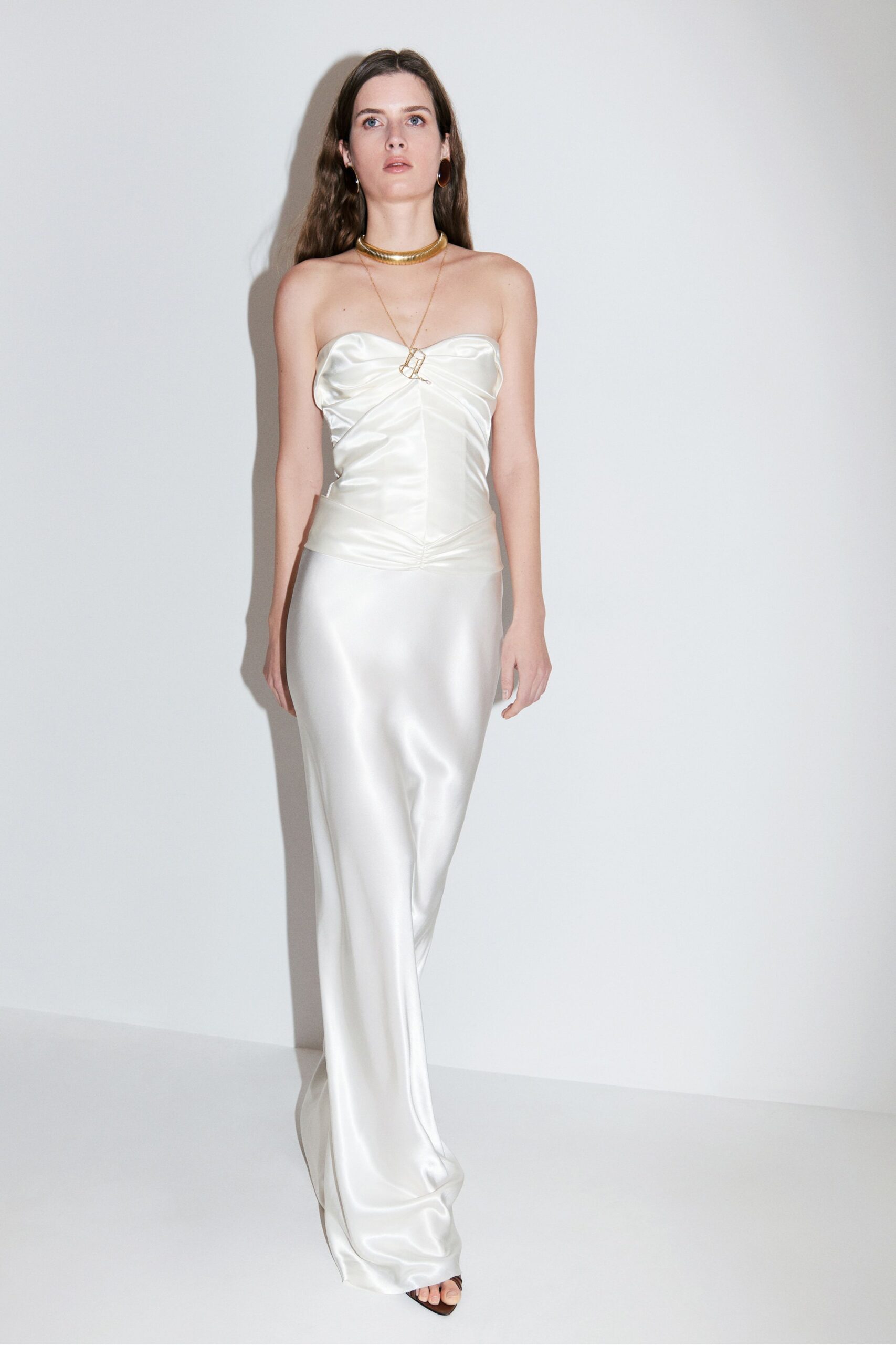 white satin strapless fitted ruched shiny maxi gown