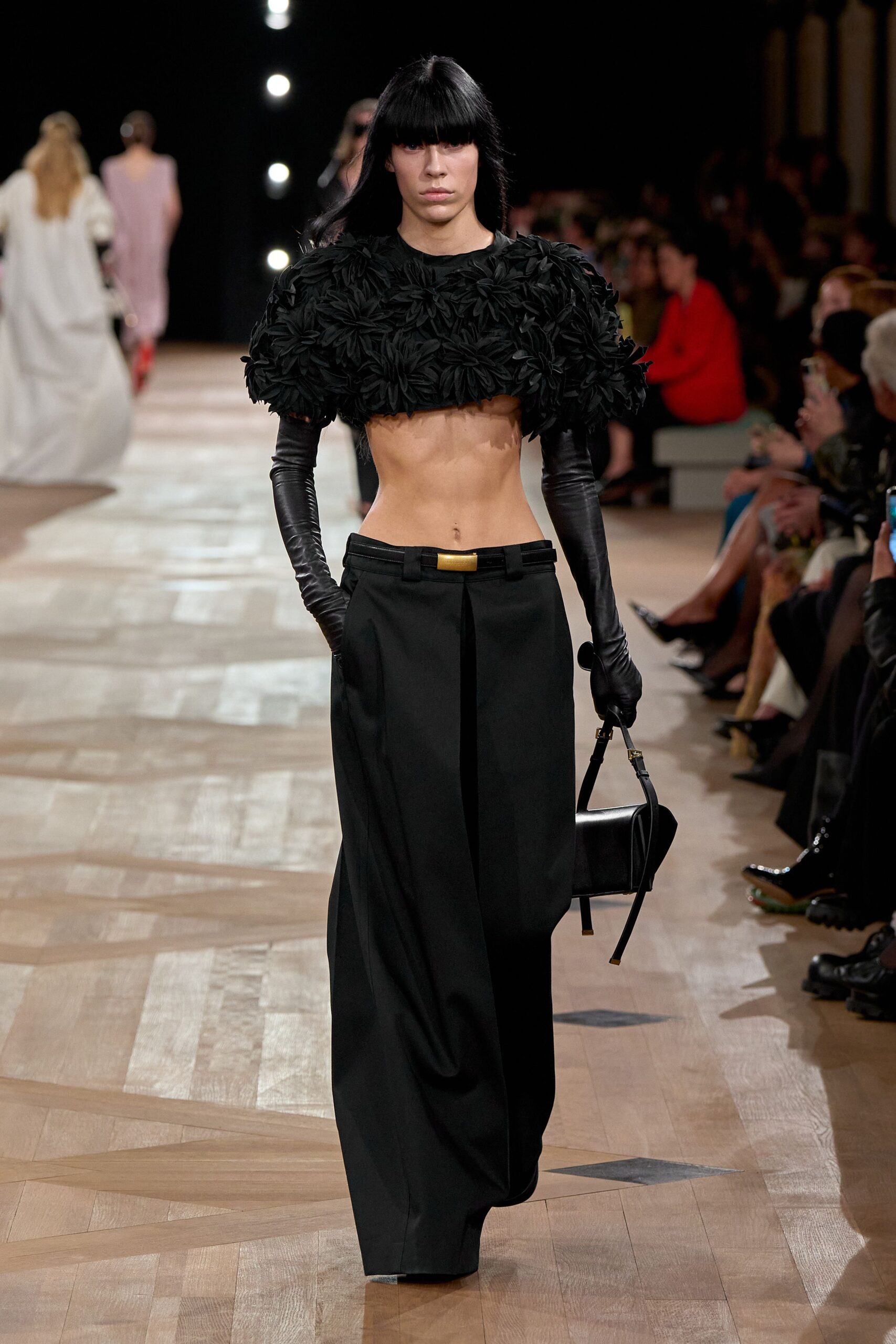 black ruffled top with wide-leg pants