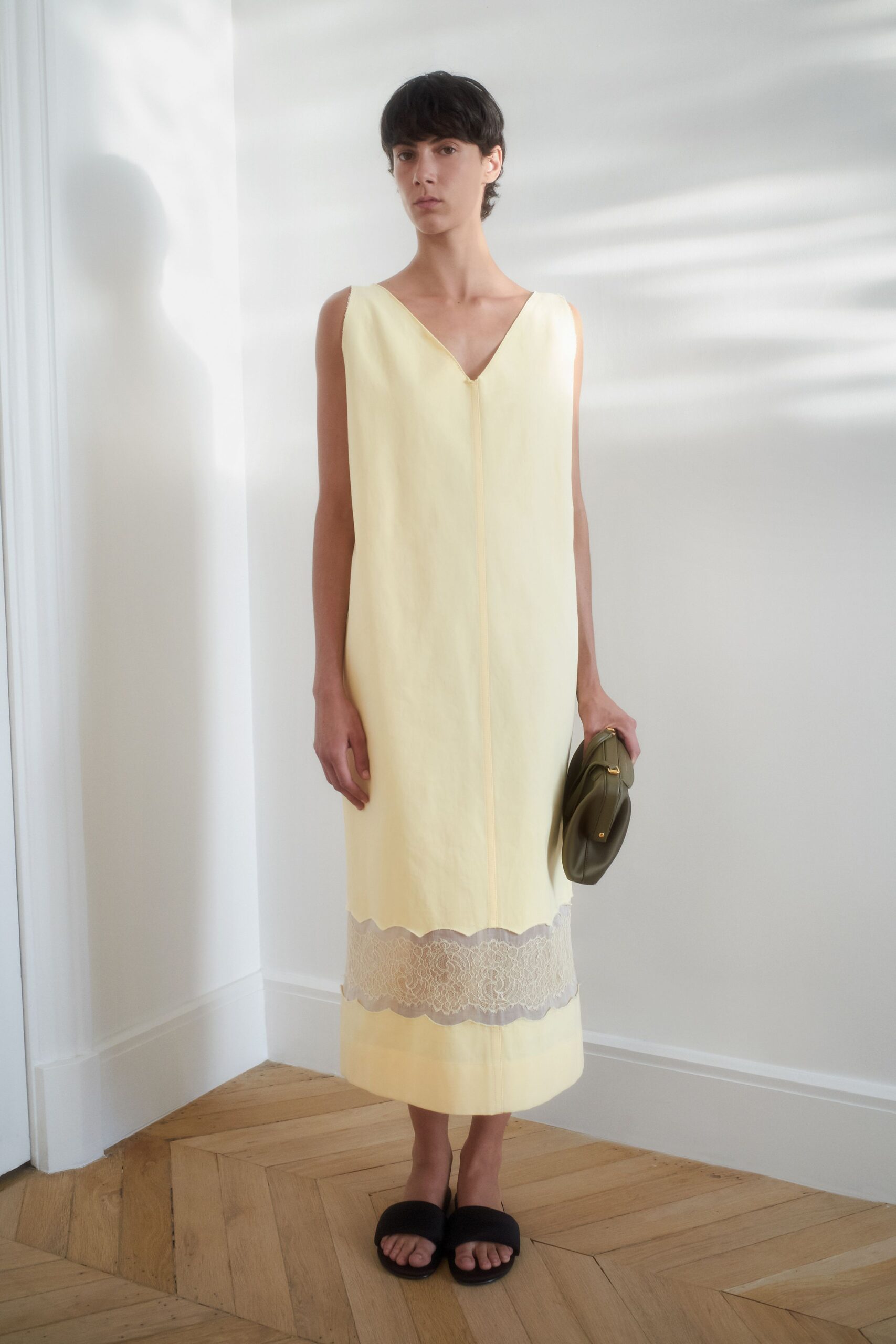 yellow midi dress with black shoes