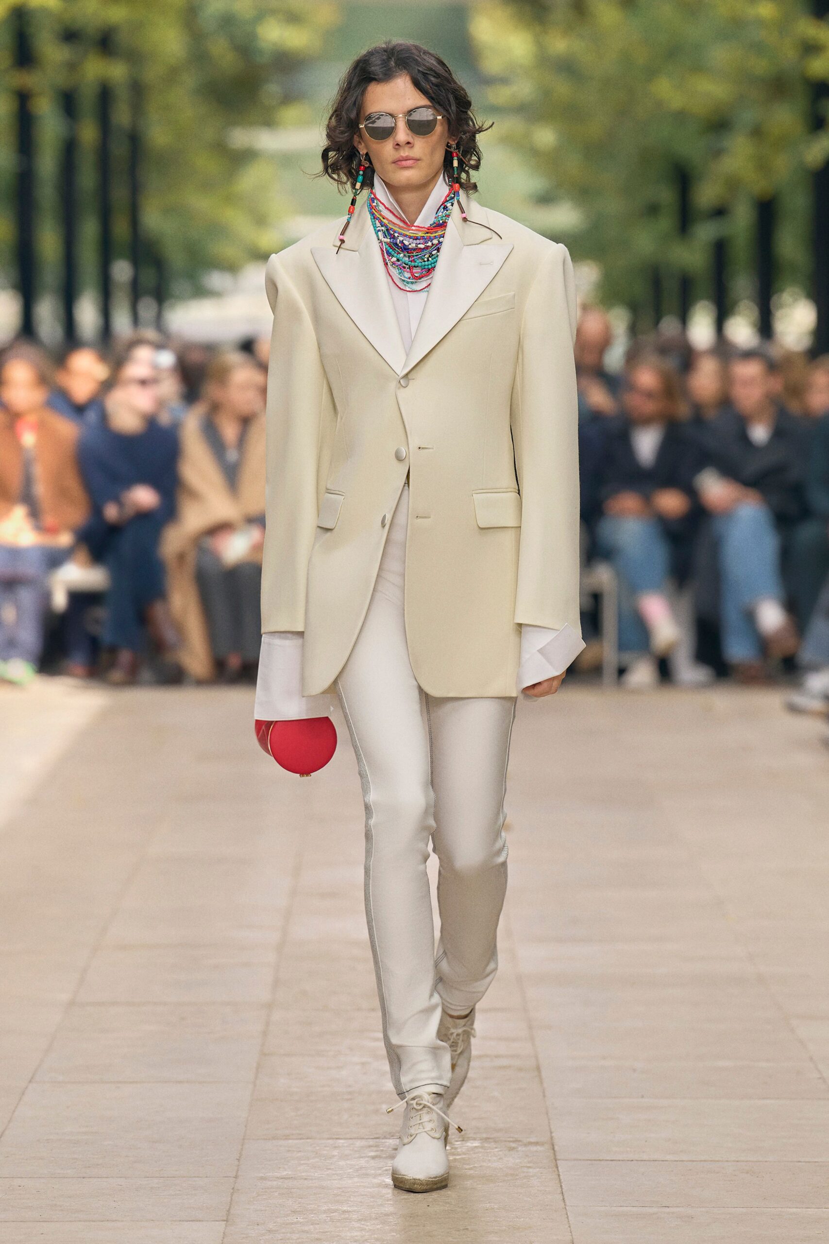 white tailored blazer with red bag