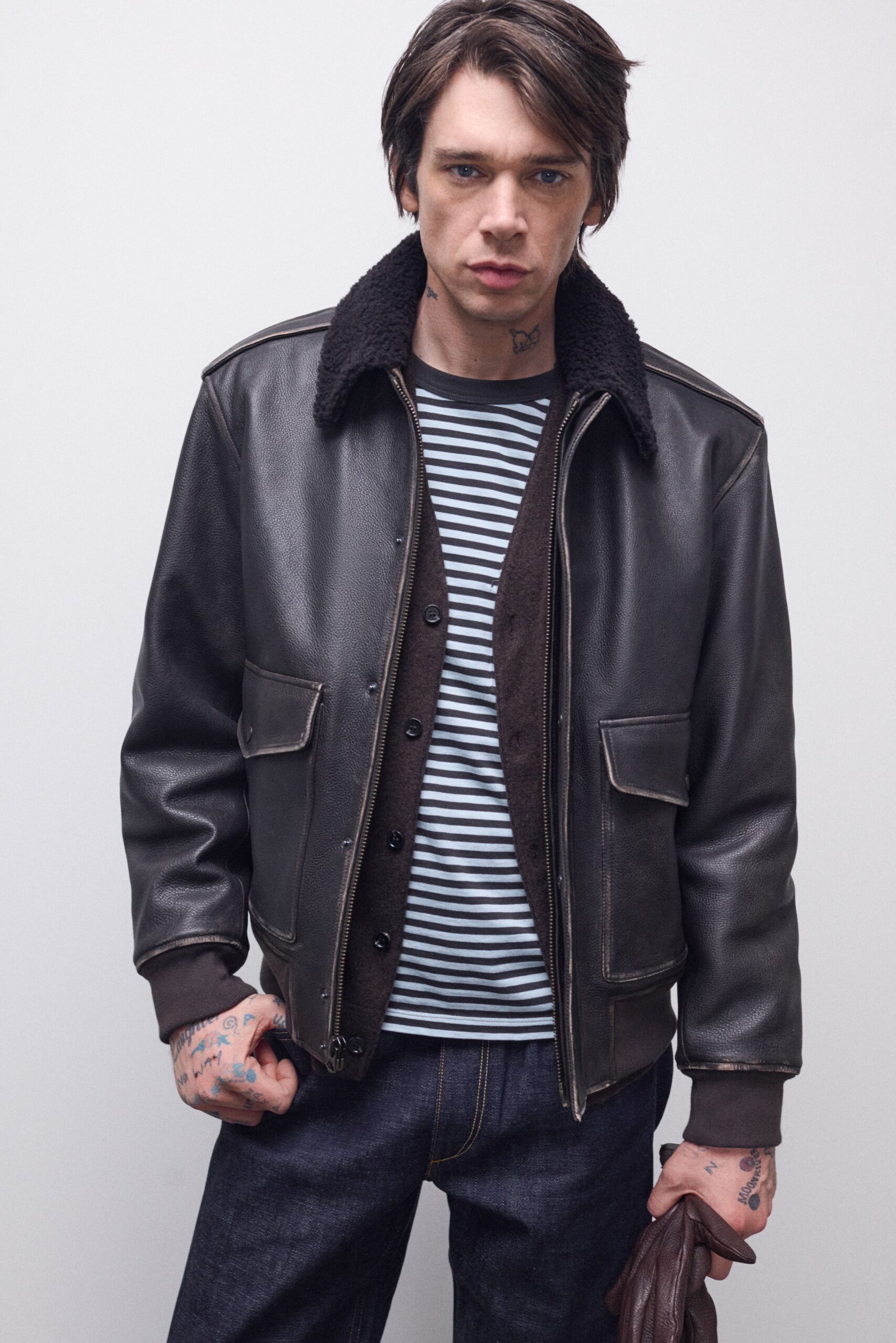 black leather jacket with striped shirt