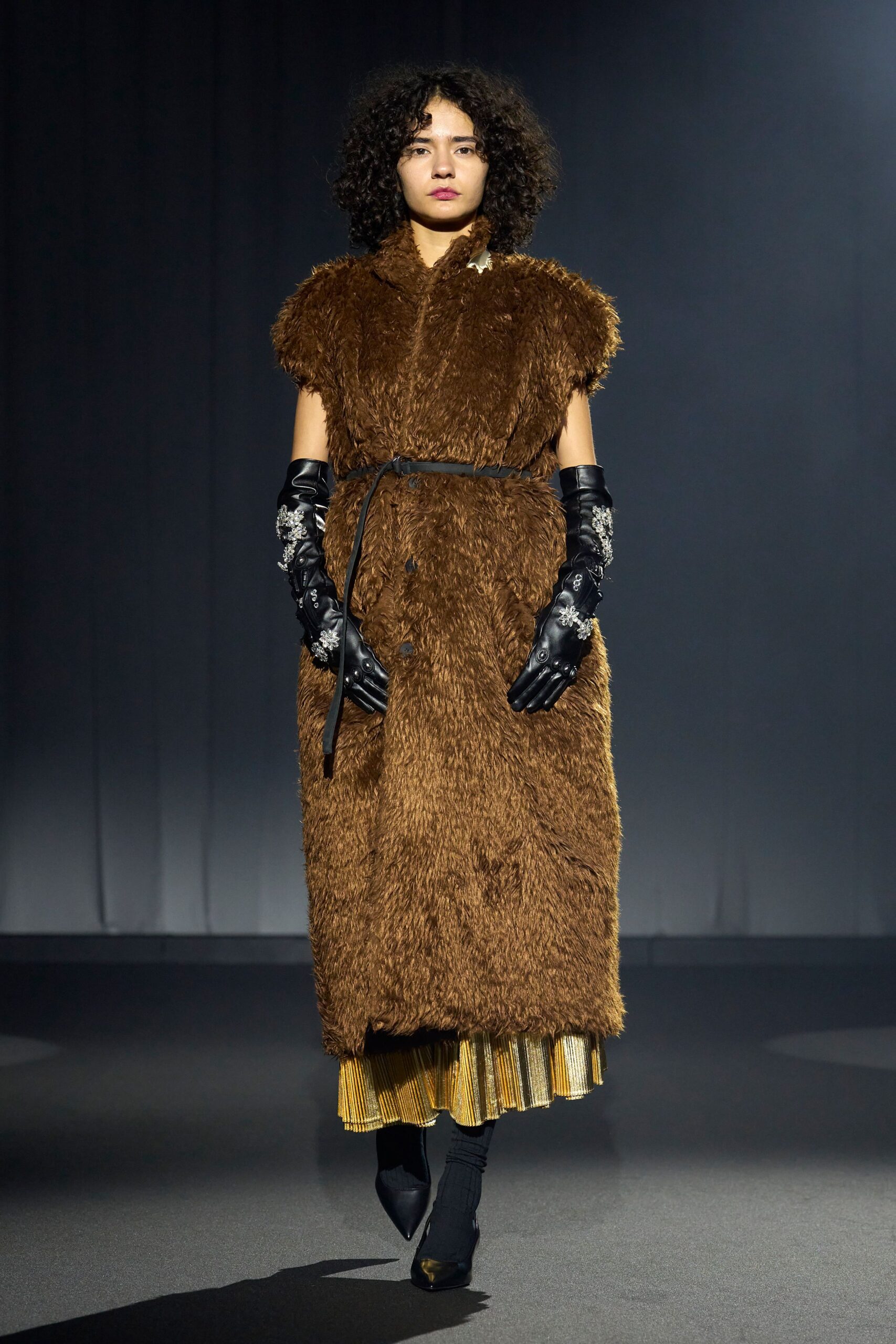brown faux-fur coat with pleated skirt