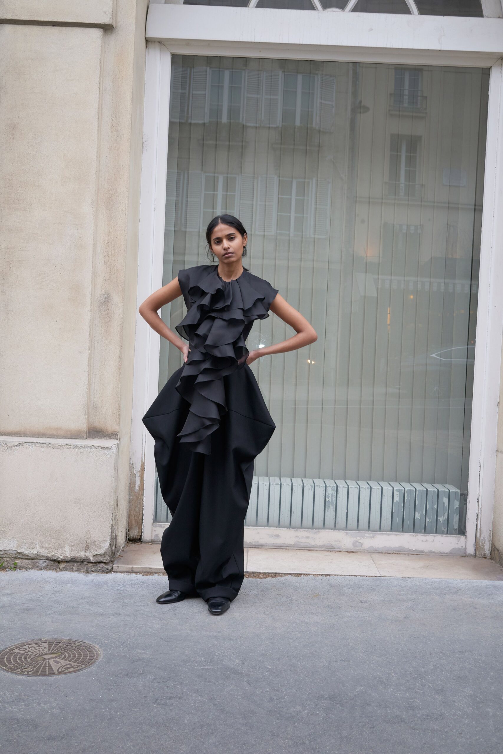 black cotton sleeveless v-neck fitted ruffled layered jumpsuit