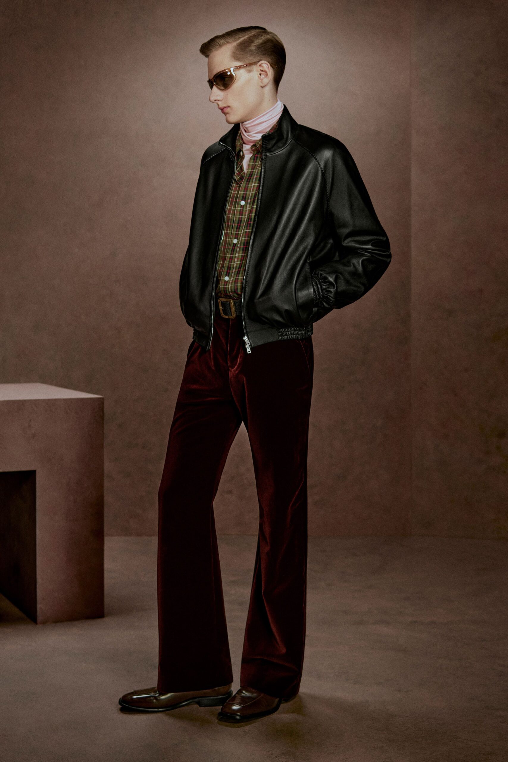 black leather jacket with wide-leg pants