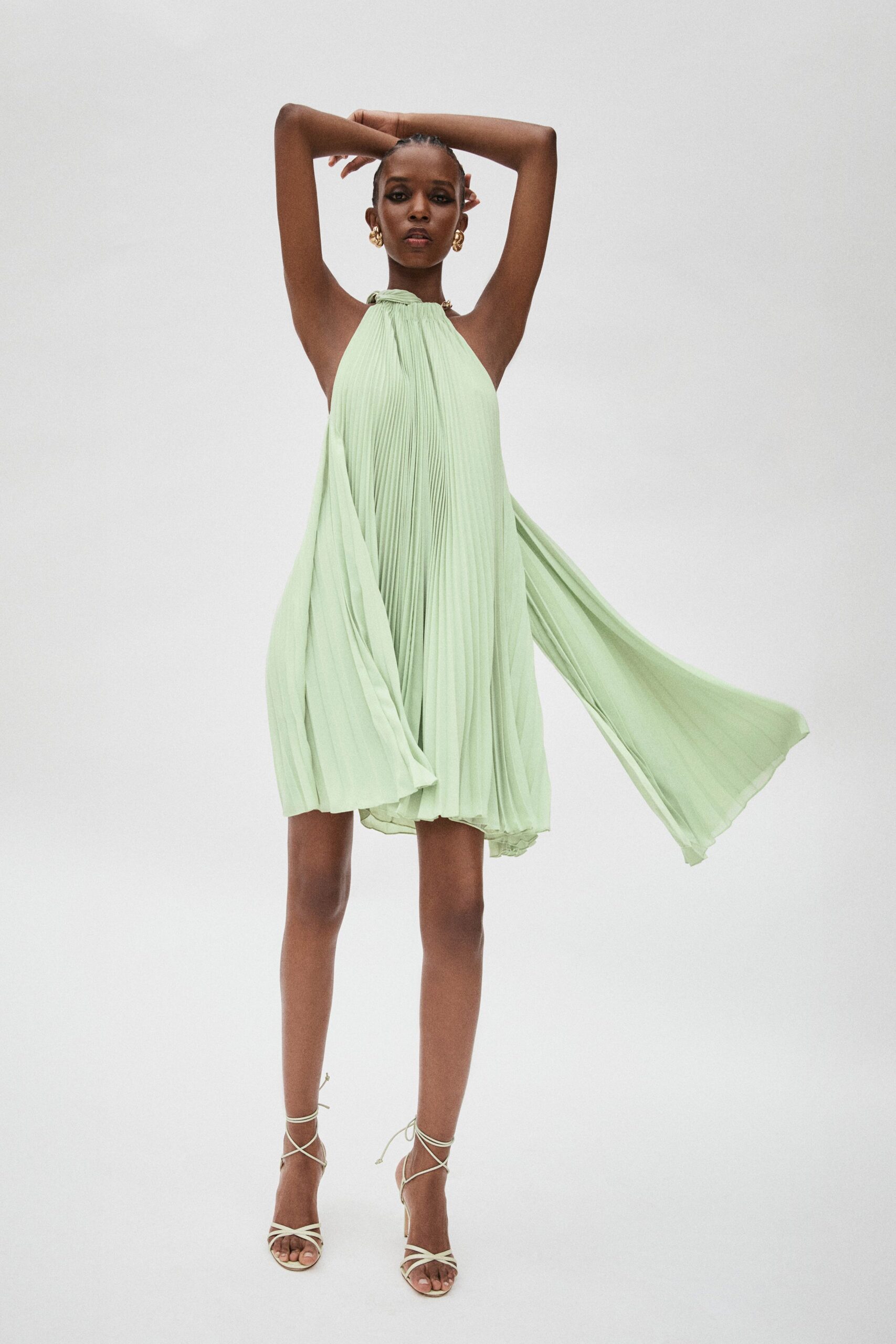 green silk sleeveless halter fitted pleated flowing dress