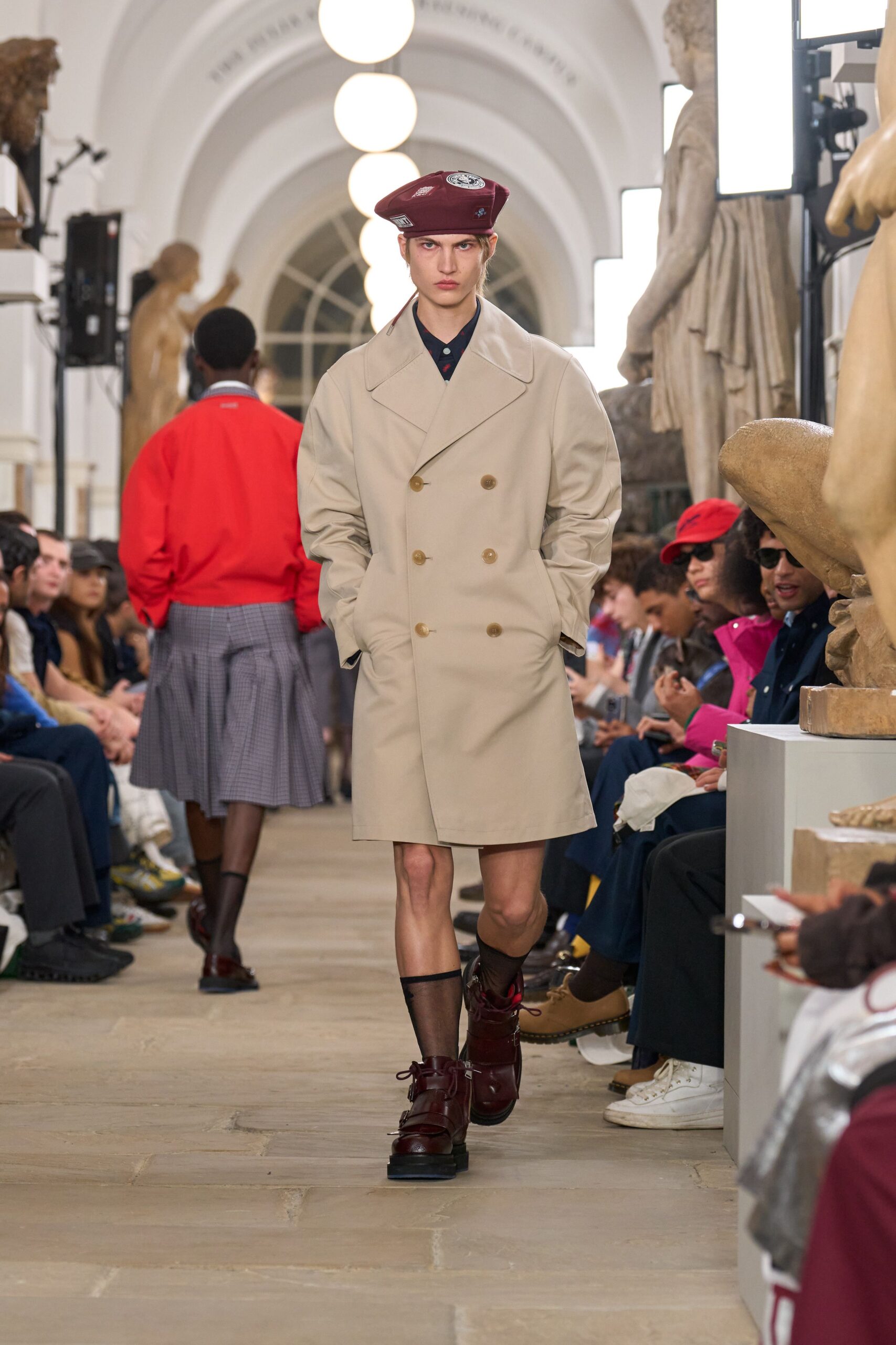beige tailored coat with red hat